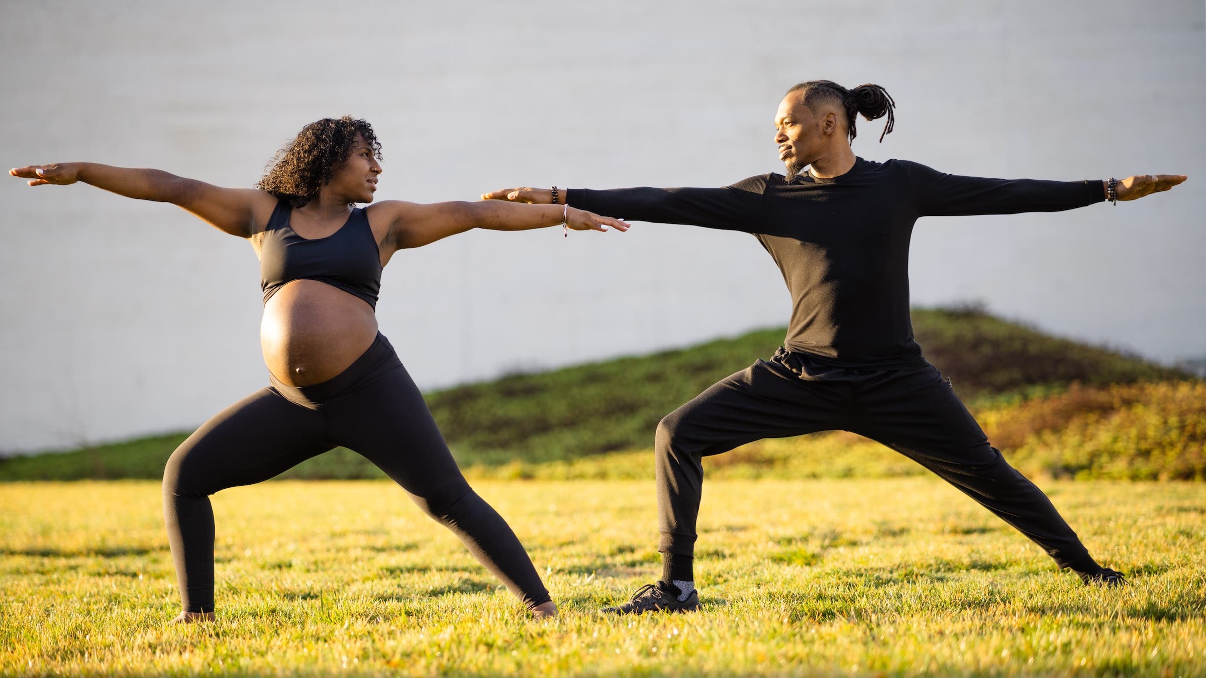 Jarrick Browner and Jeselene Andrade practicing couples yoga