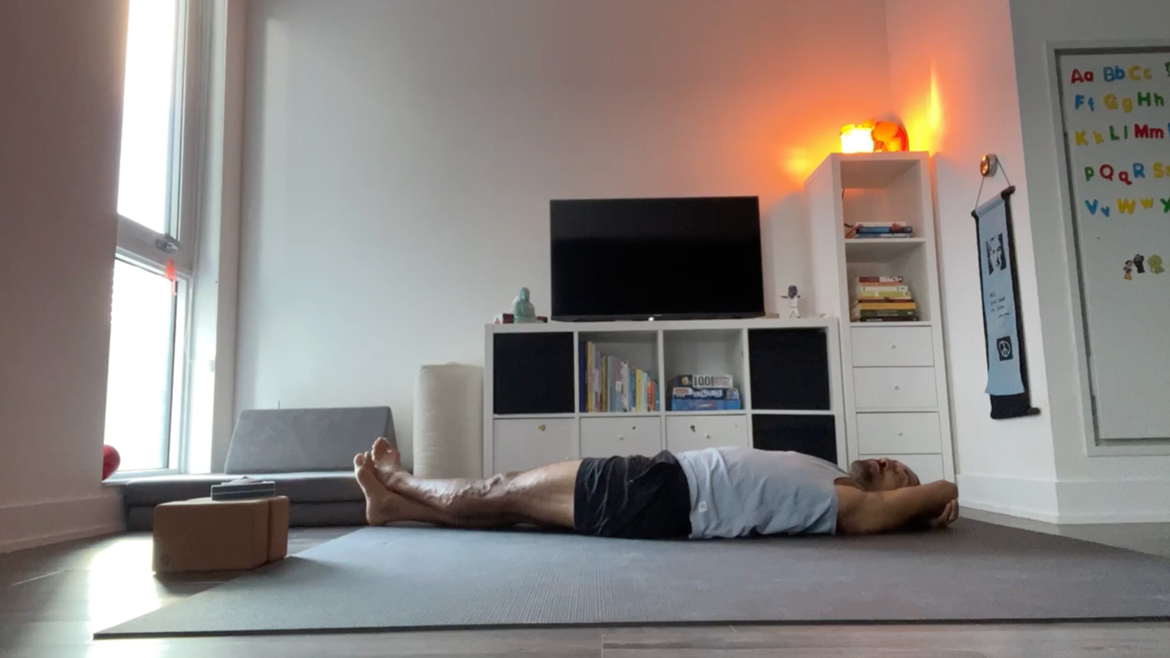 Yoga teacher Jaffer Hussain in Banana Pose, part of his yin yoga practice