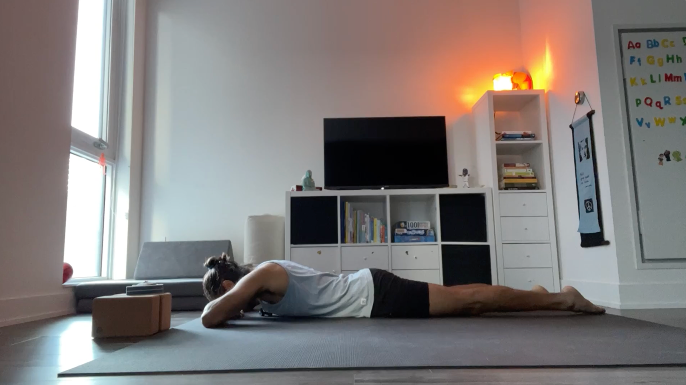 Yoga teacher Jaffer Hussain in Crocodile Pose, part of his yin yoga practice