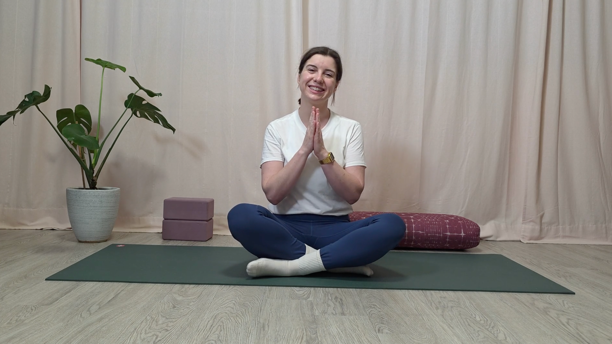 Teacher Katie McGrath closing her yin yoga for neck pain practice