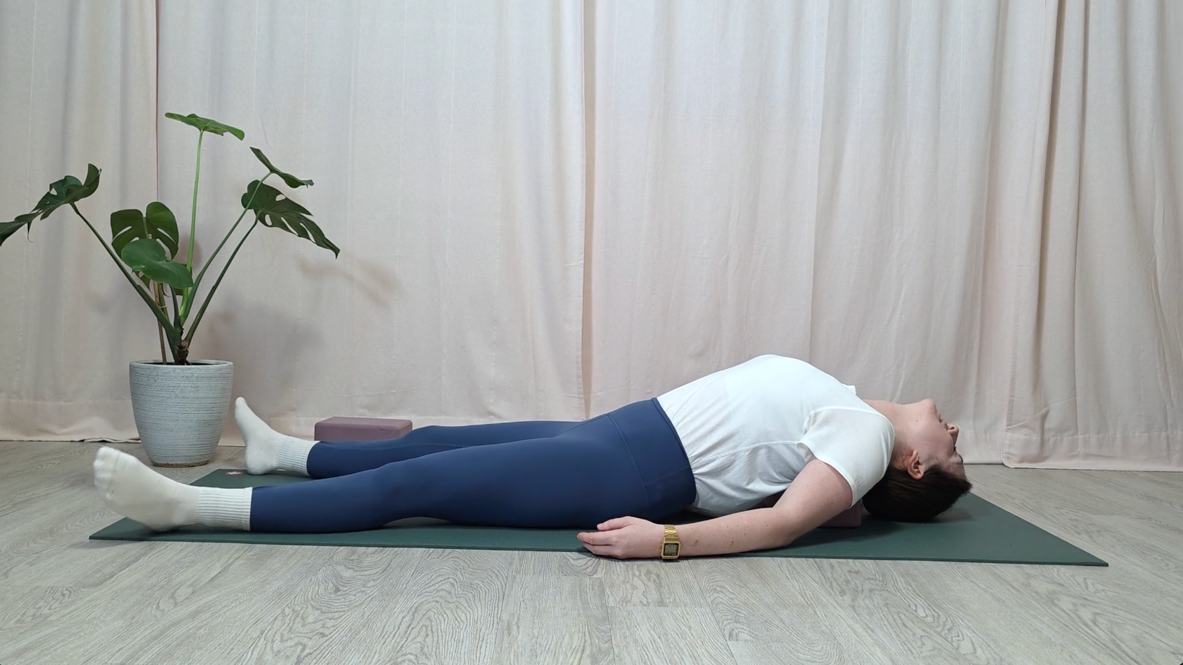 Yoga teacher Katie McGrath in Supported Fish Pose, part of her yin yoga for neck pain practice