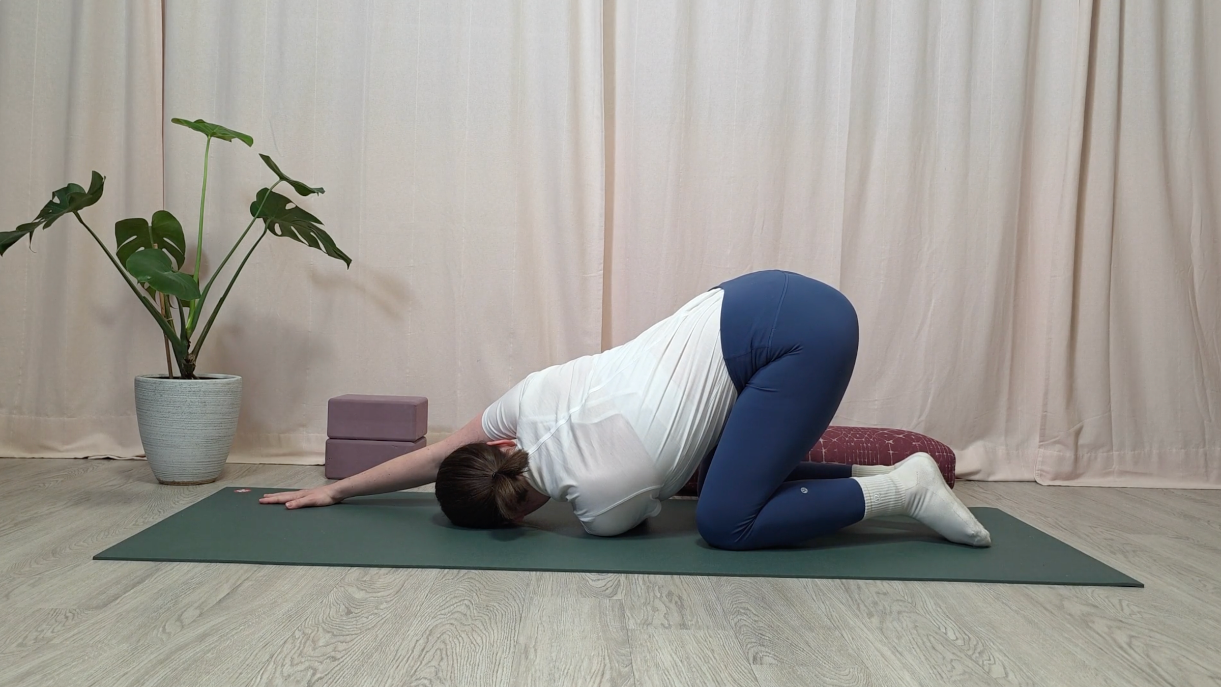 Yoga teacher Katie McGrath in Thread the Needle, part of her yin yoga for neck pain practice