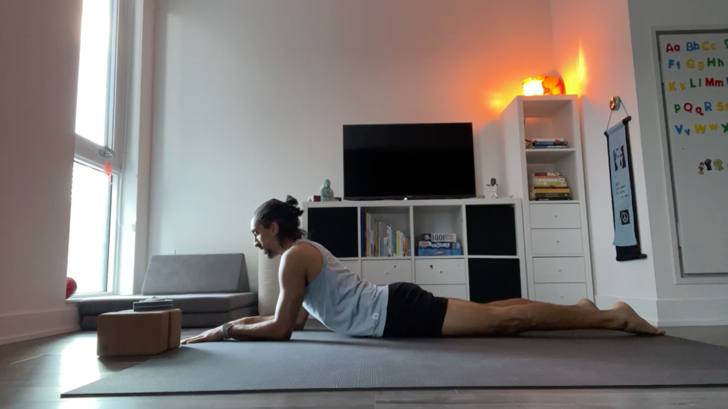 Yoga teacher Jaffer Hussain in Sphinx Pose, part of his yin yoga practice