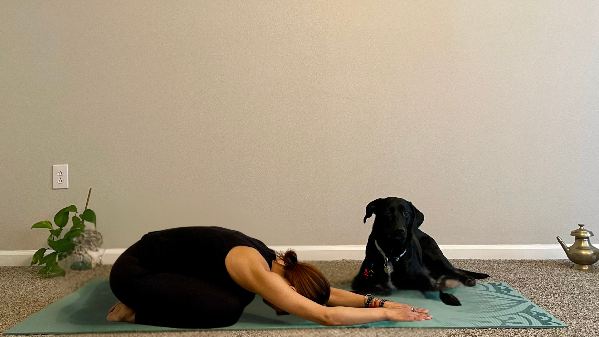 Woman lying on a yoga mat practicing yoga for anxiety