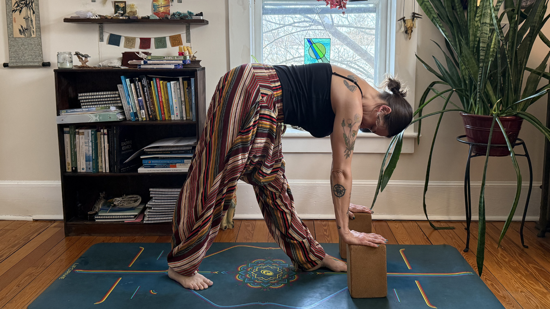 Woman leaning forward with her hands on blocks