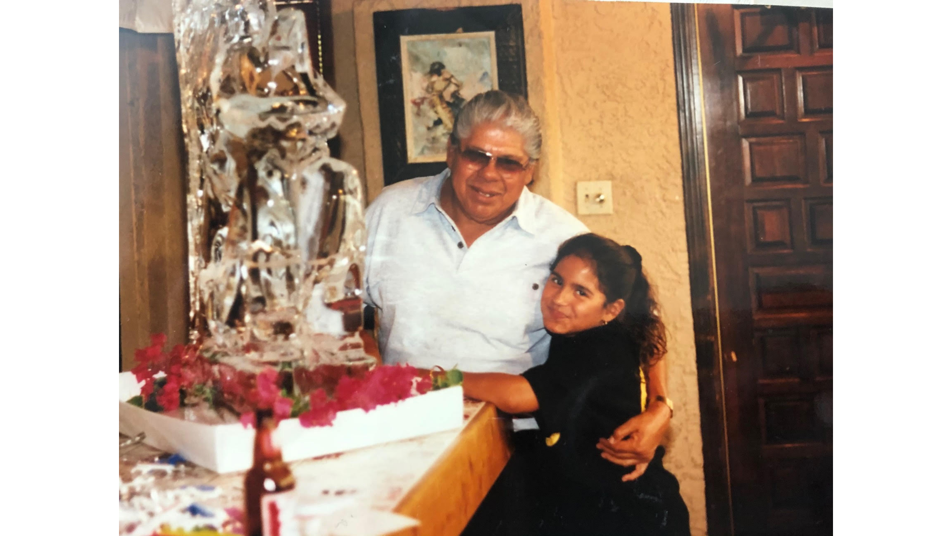 Yoga teacher Anaiz Ochoa as a young girl with her grandfather, Tati