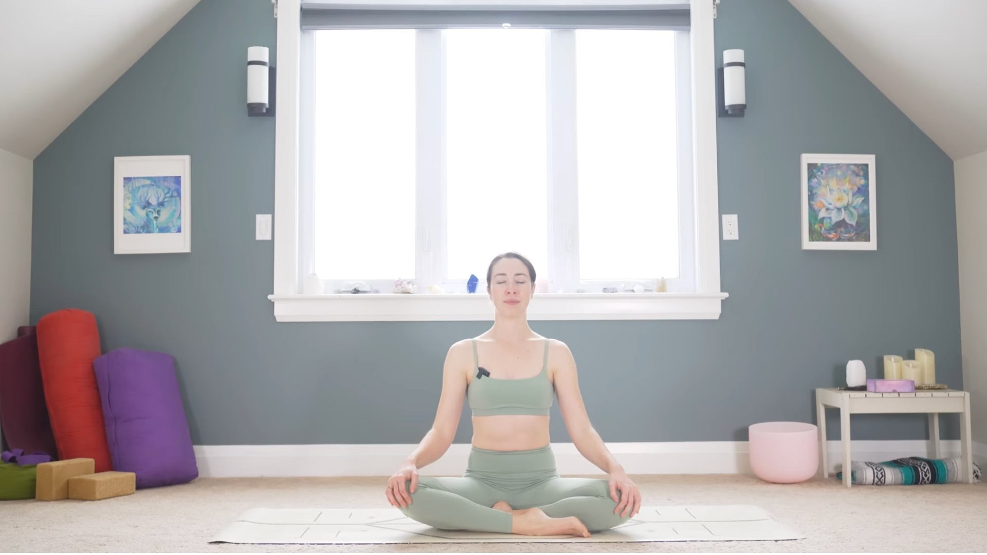 Woman sitting on a mat meditating