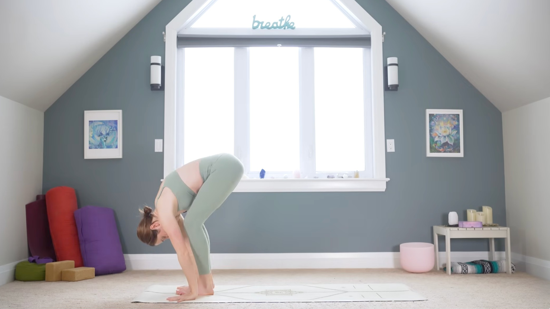 Woman leaning forward in a Standing Forward Bend