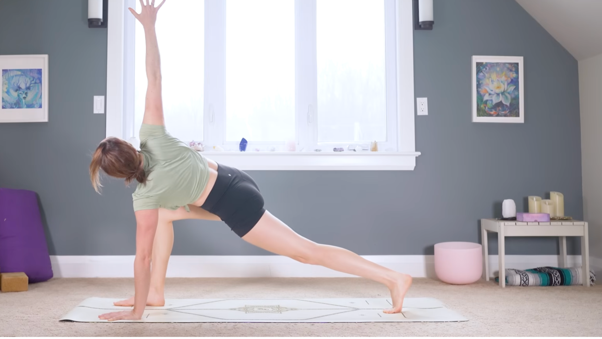 Woman on a mat during a 10-minute morning yoga for back while twisting 