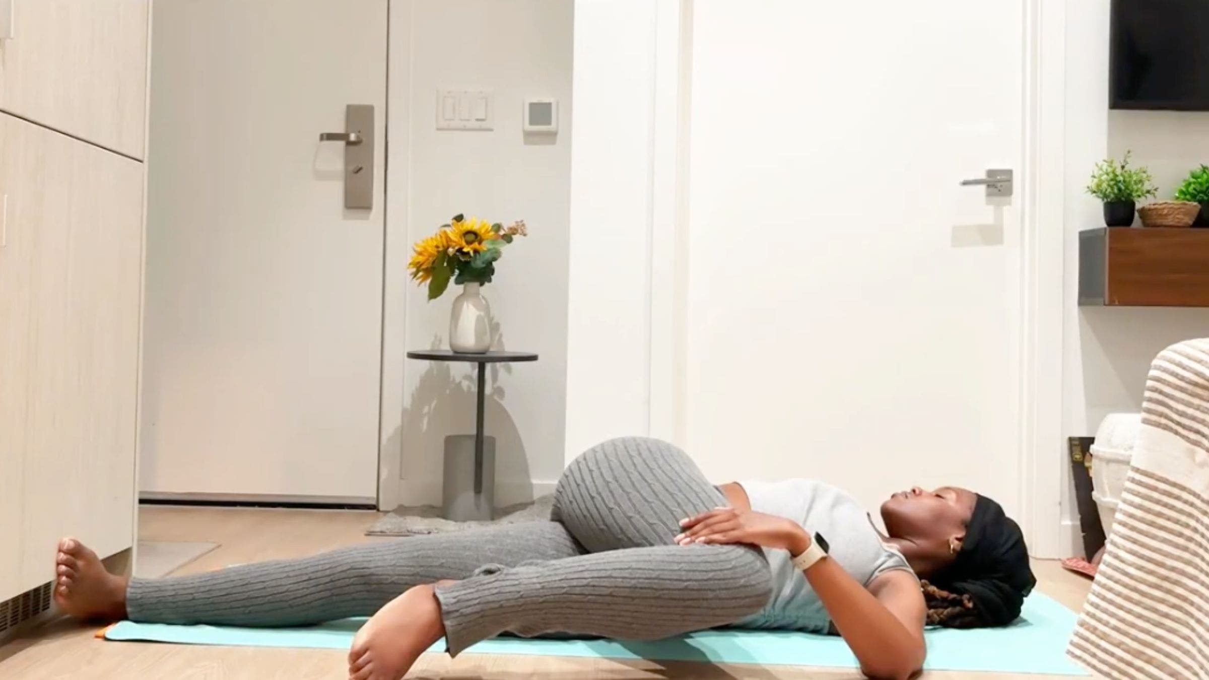 Ramoni Overton practicing Supine Spinal Twist.