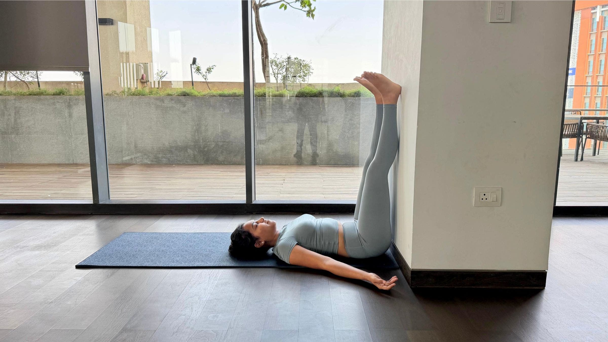 Riya Davda practicing Legs Up the Wall.