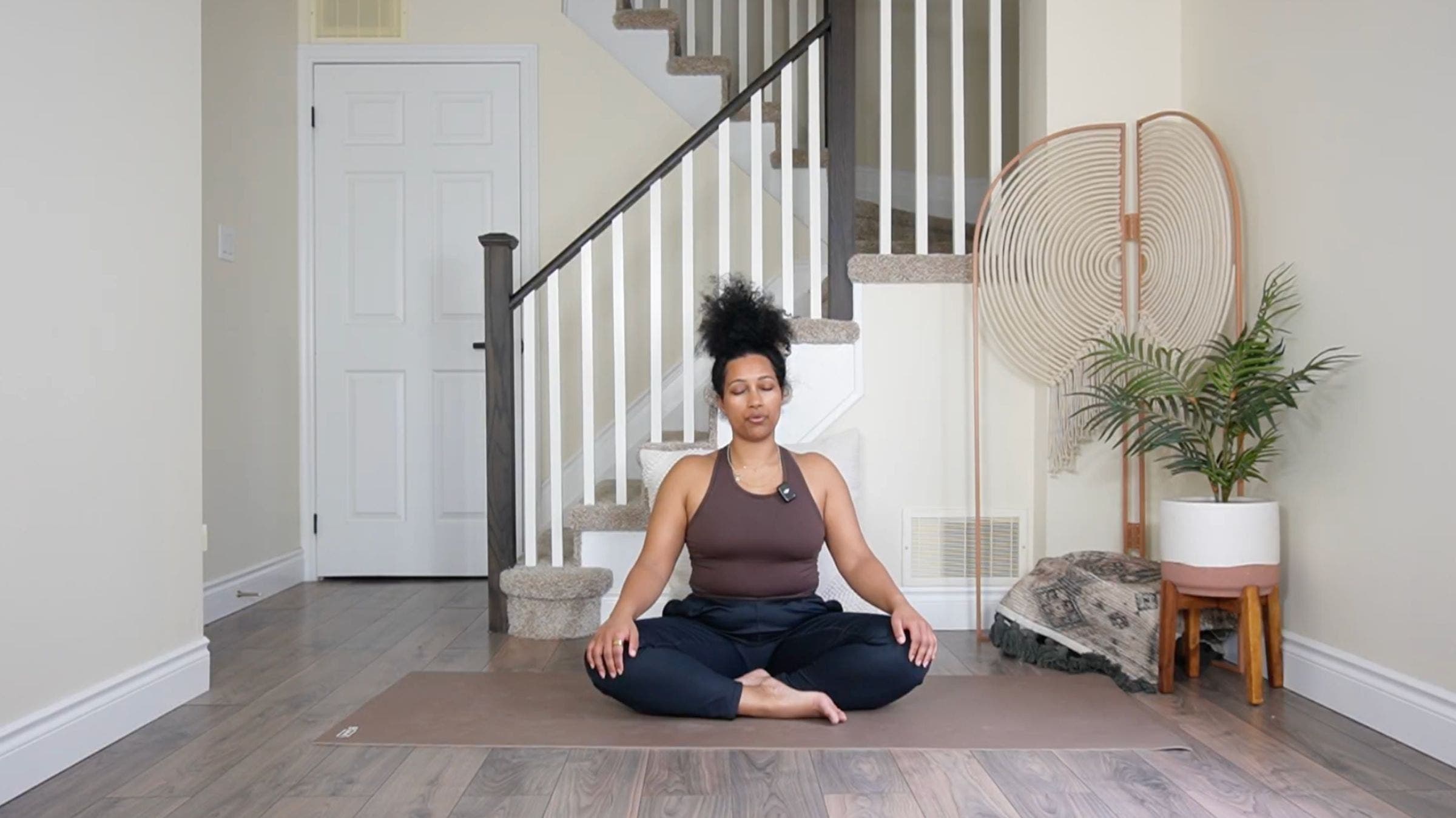 Yoga teacher practicing Easy Pose.