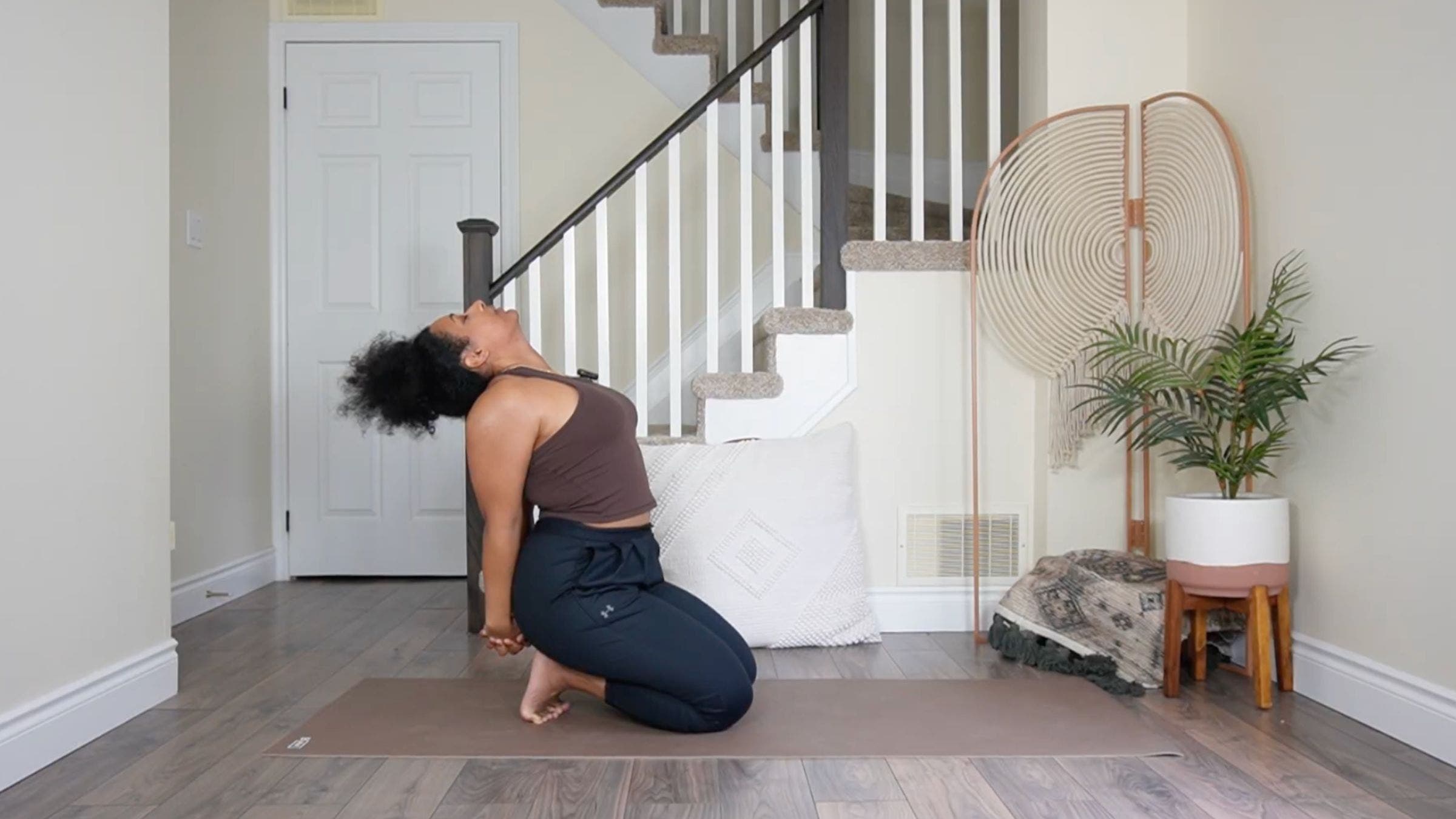 Yoga teacher practicing Thunderbolt Pose.