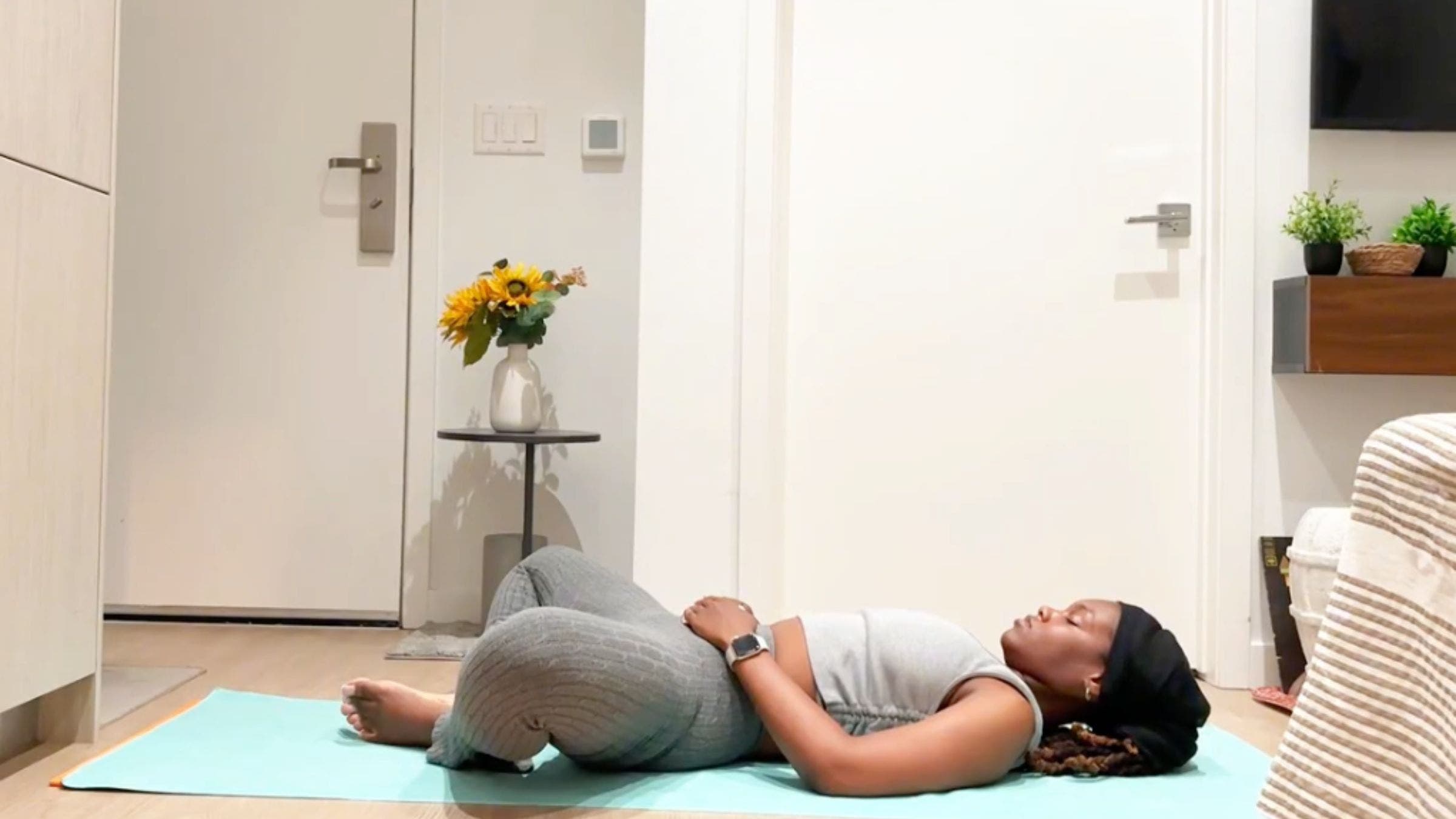 Ramoni Overton practicing reclined bound angle pose.