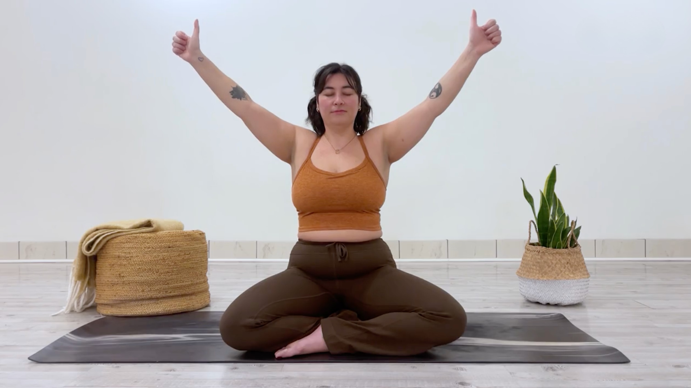 Yoga teacher Taylor Lorenz doing a breathing exercise, or pranayama practice