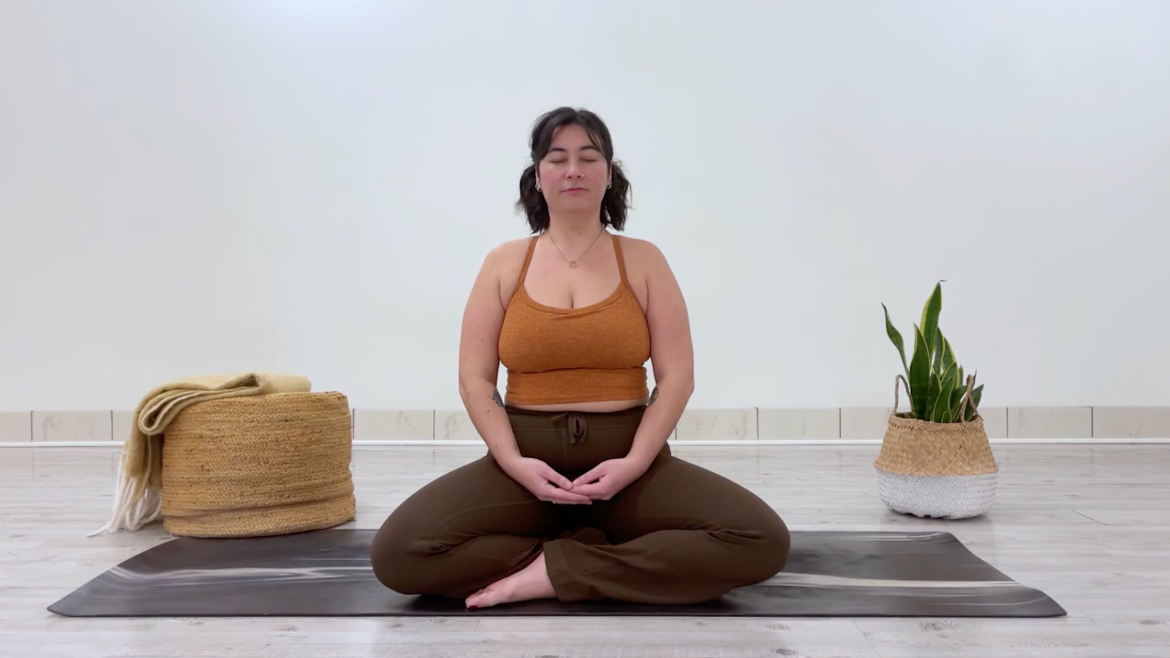 Yoga teacher Taylor Lorenz doing a breathing exercise, or pranayama practice