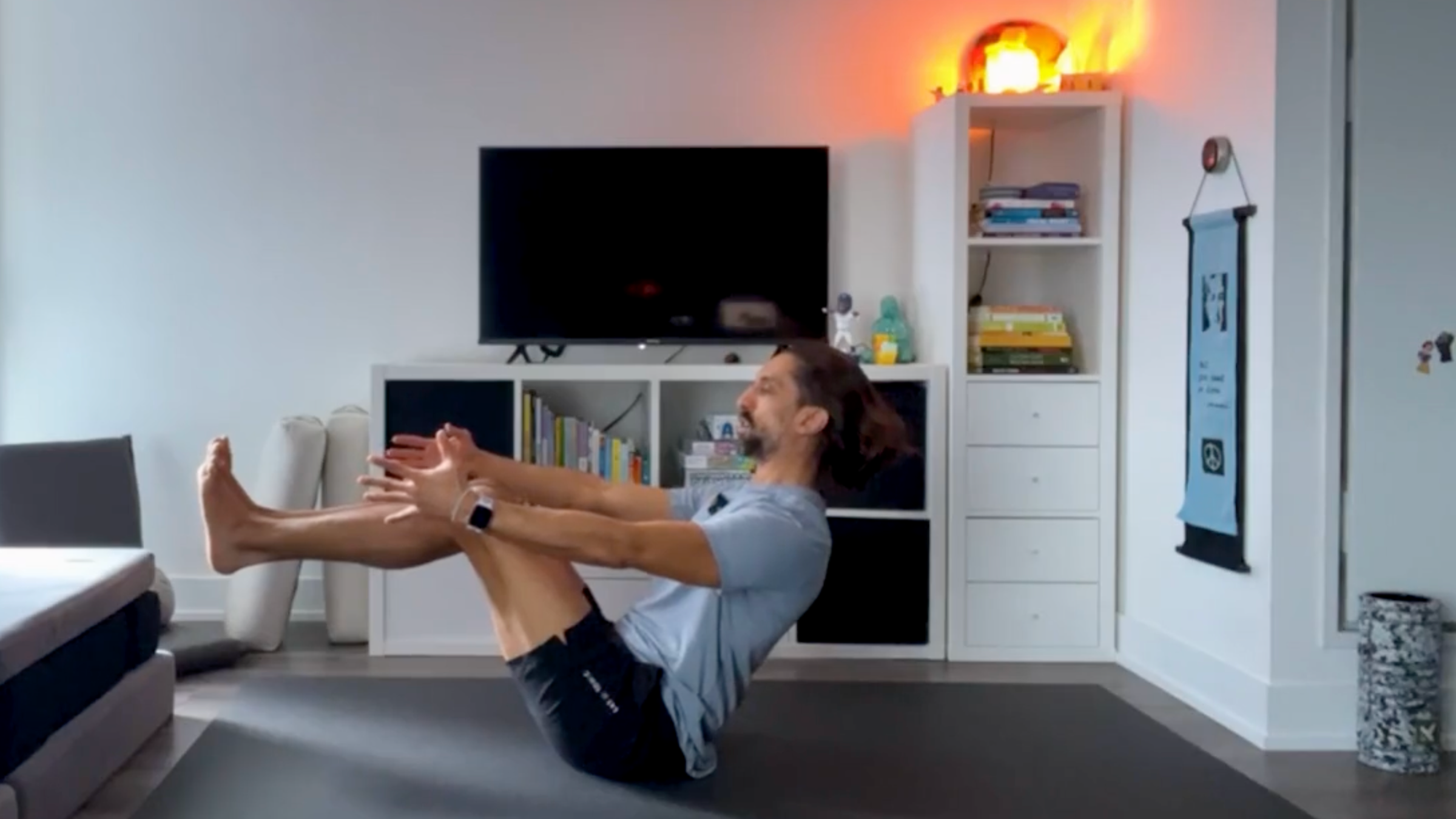 Yoga teacher Jaffer Hussain in Dynamic Boat Pose, part of his yoga for core strength practice