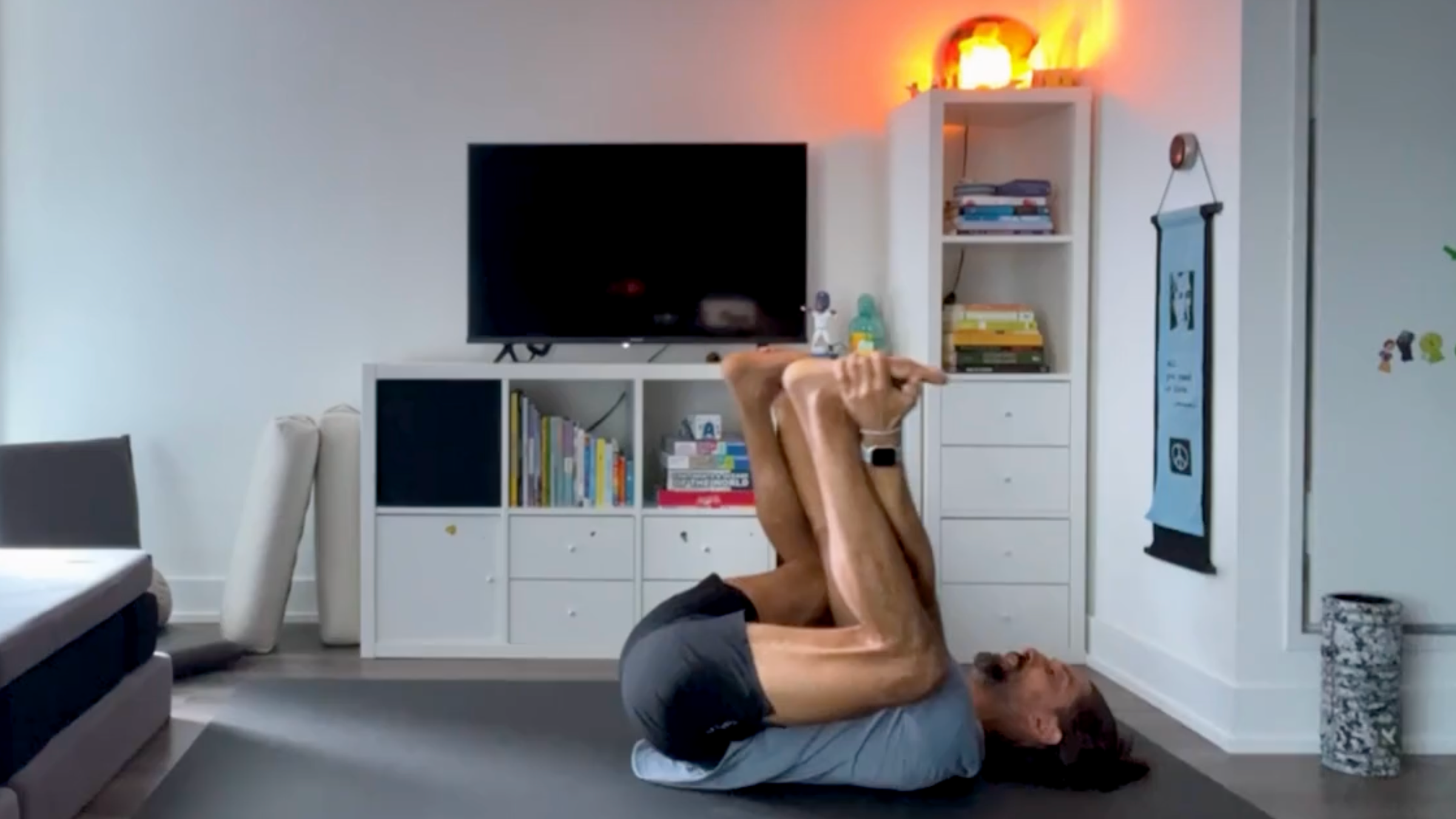 Yoga teacher Jaffer Hussain in Happy Baby, part of his yoga for core strength practice