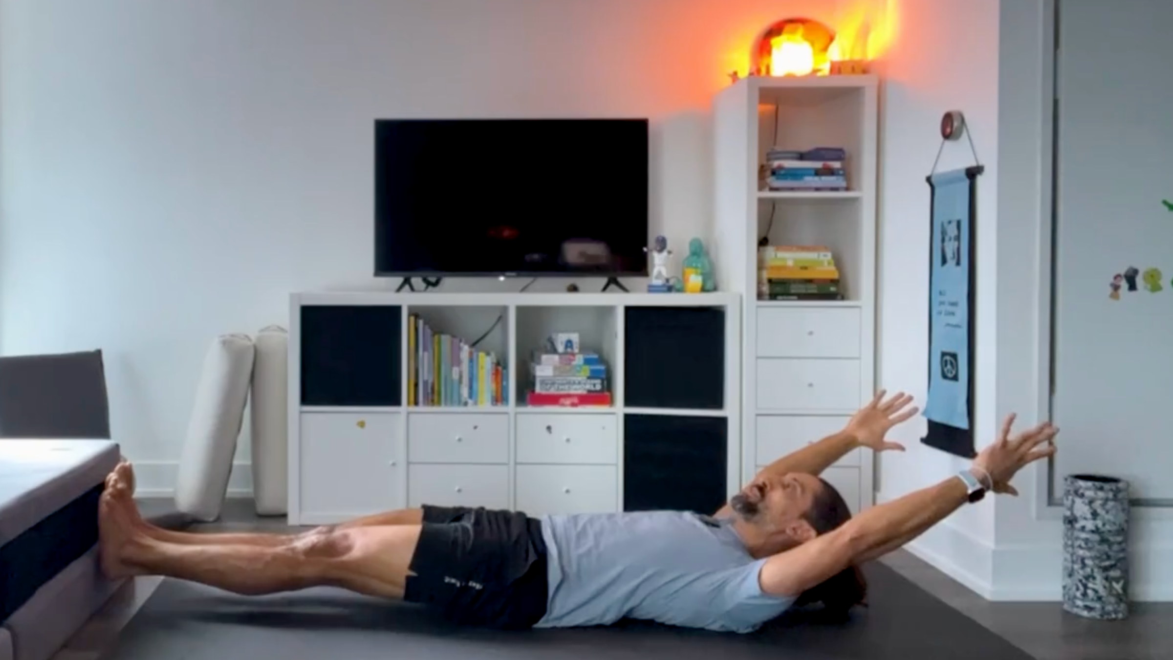 Teacher Jaffer Hussain in Low Boat Pose