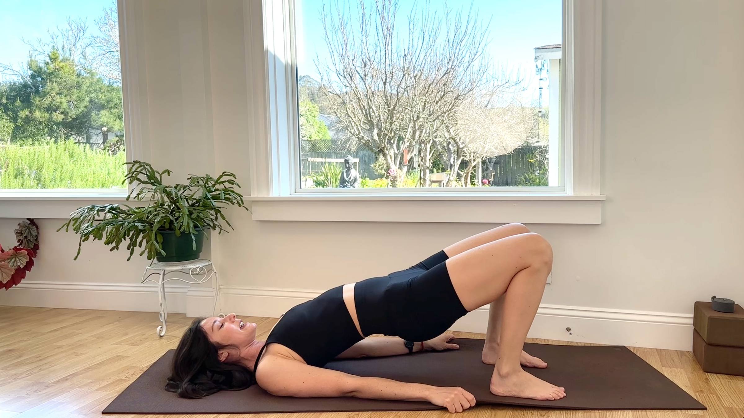 Yoga teacher Michelle Martone in reclined Dynamic Bridge, part of her routine of core strengthening exercises
