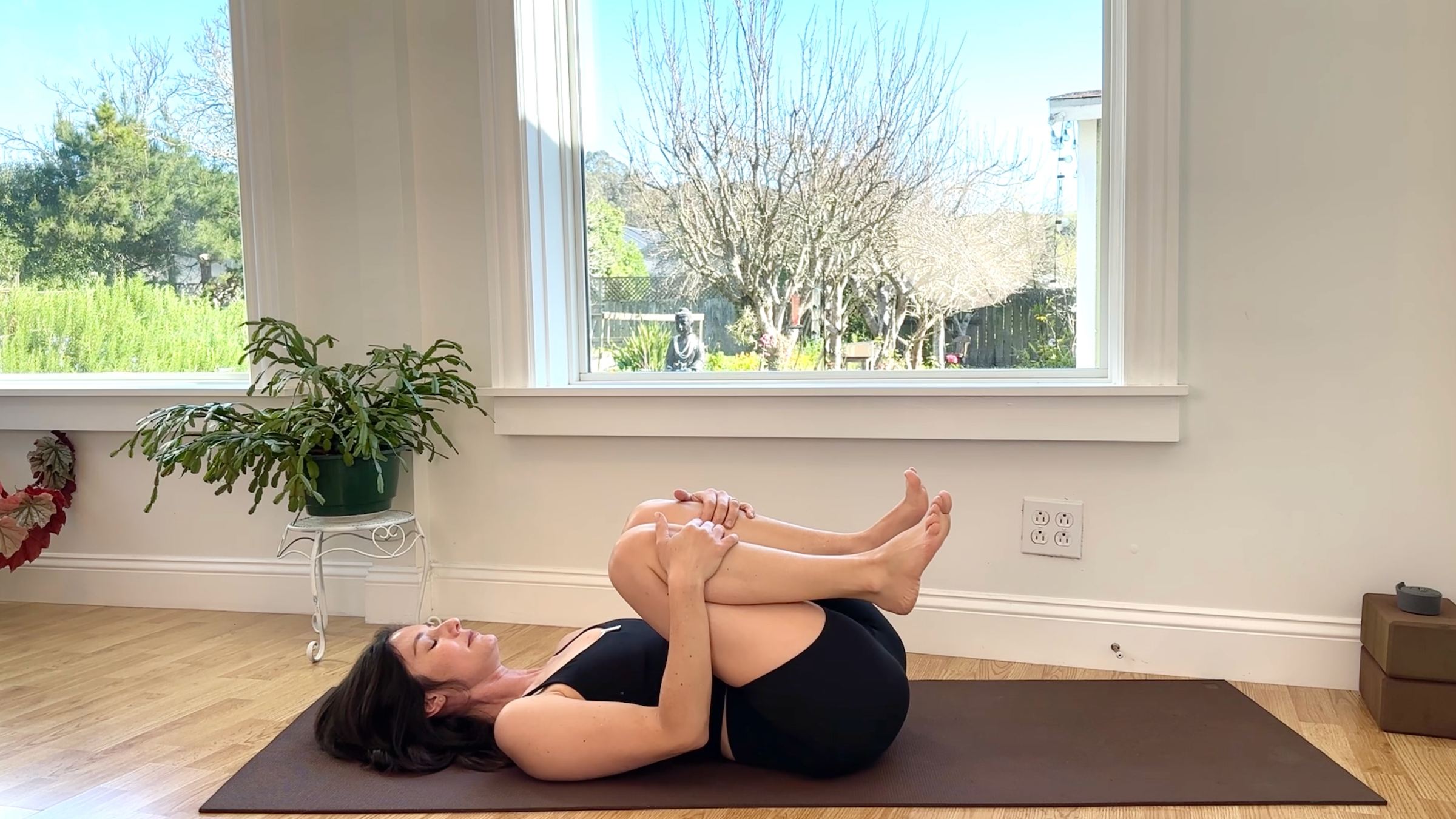 Yoga teacher Michelle Martone in Knees to Chest