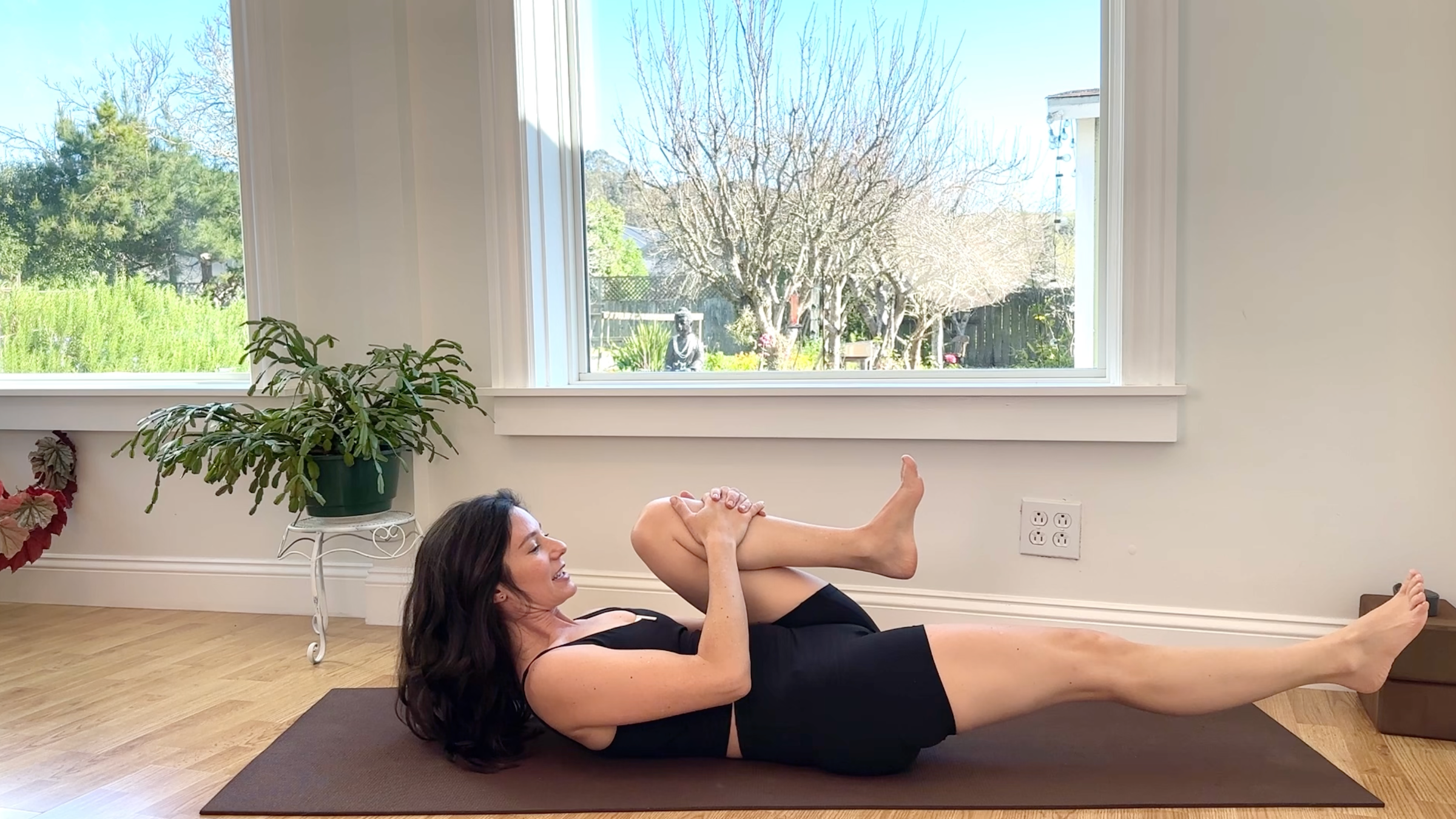 Yoga teacher Michelle Martone in Single Leg Stretches