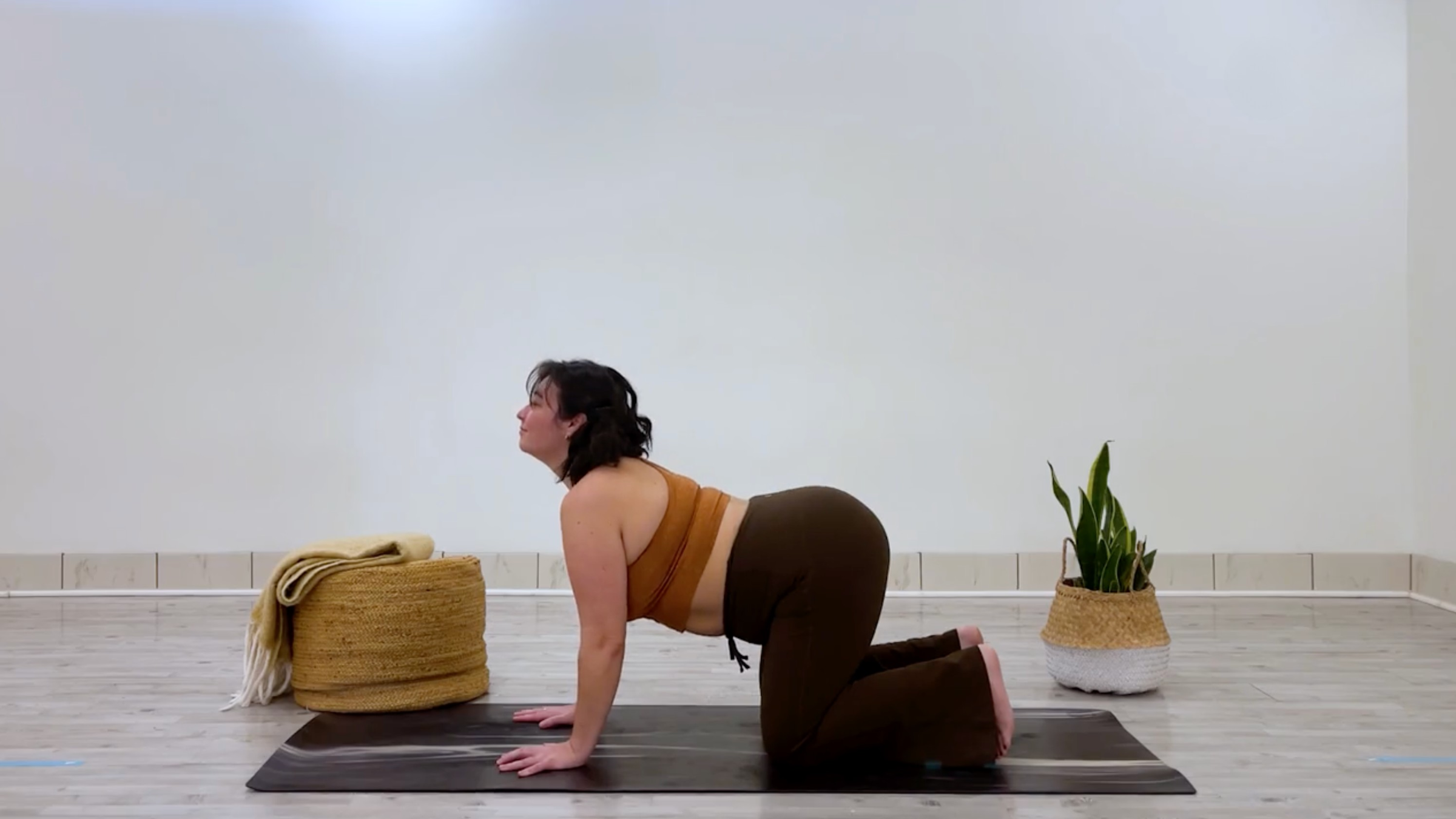 Yoga teacher Taylor Lorenz in Cow Pose, part of her good mood yoga practice