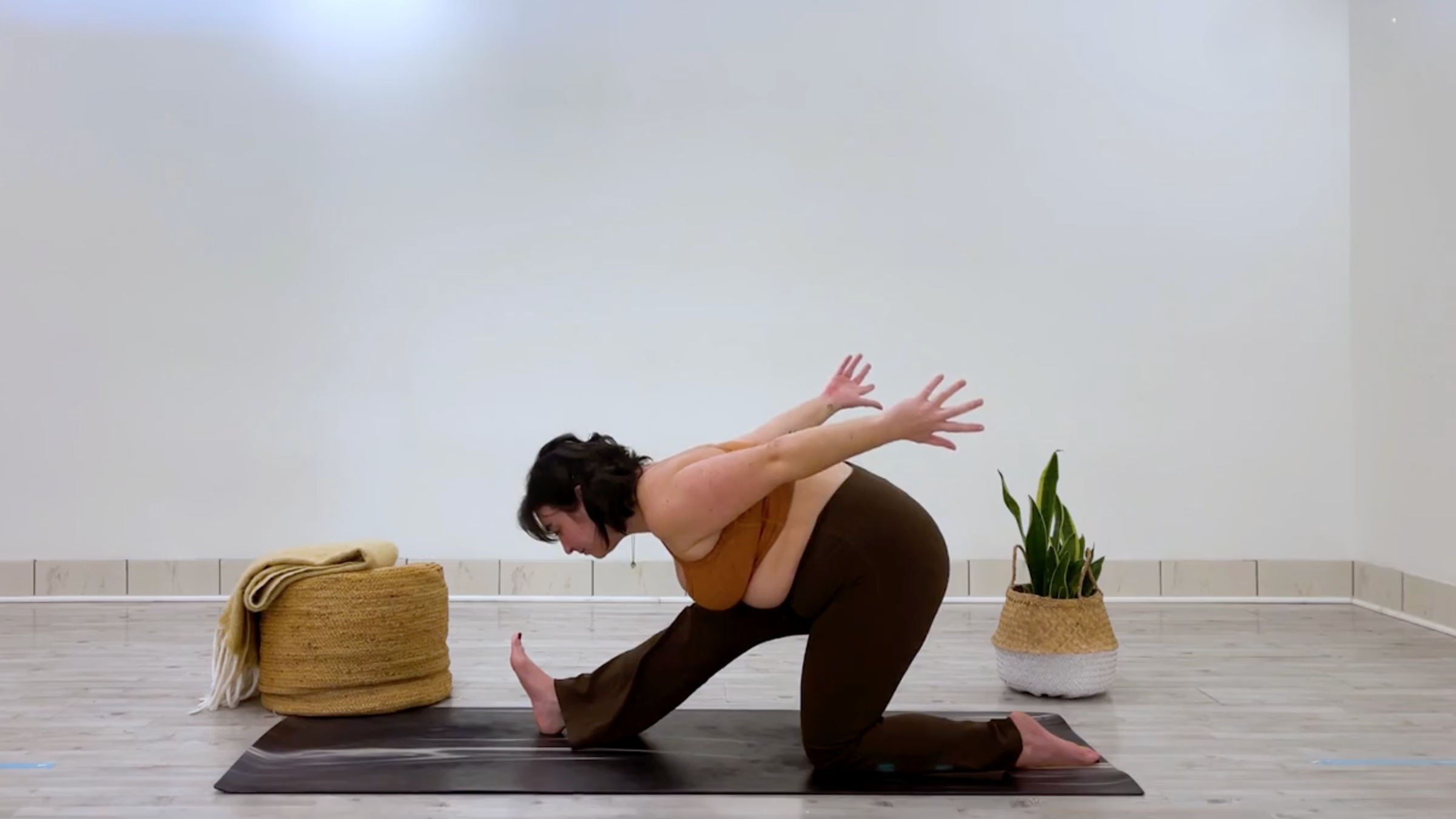 Yoga teacher Taylor Lorenz in Half Splits, part of her good mood yoga practice