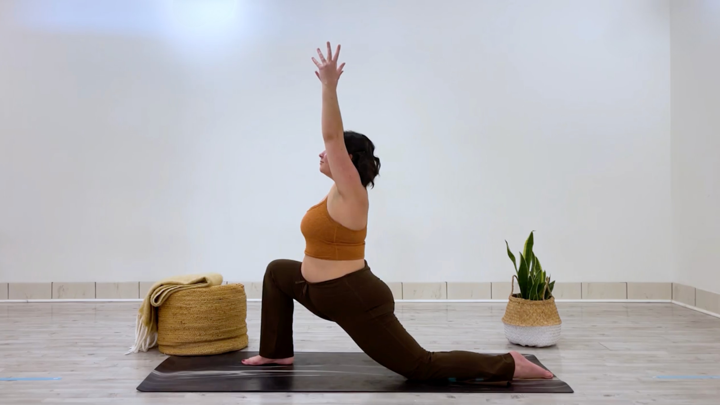 Yoga teacher Taylor Lorenz in Low Lunge, part of her good mood yoga practice