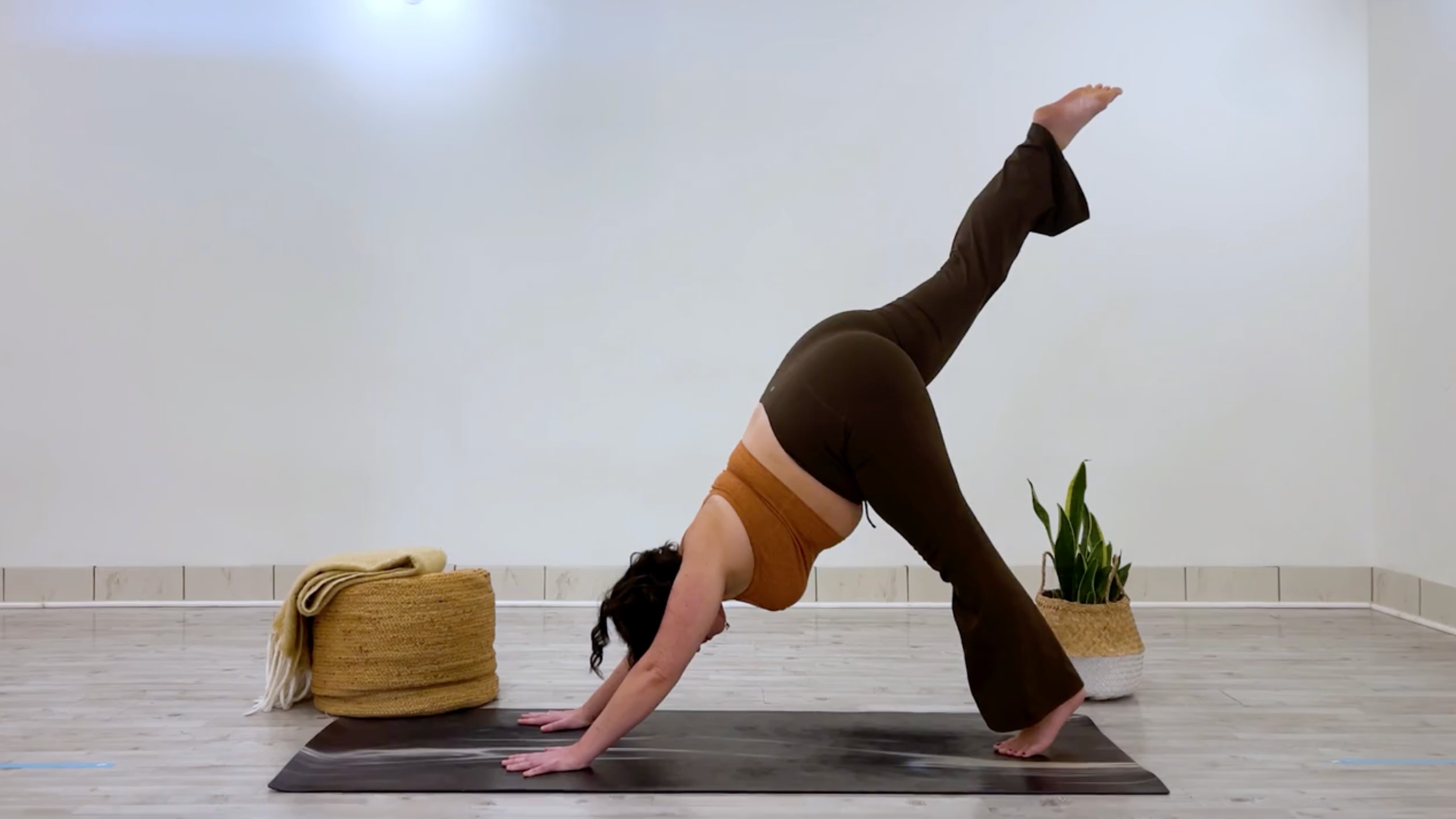 Teacher Taylor Lorenz in Three-Legged Dog Pose