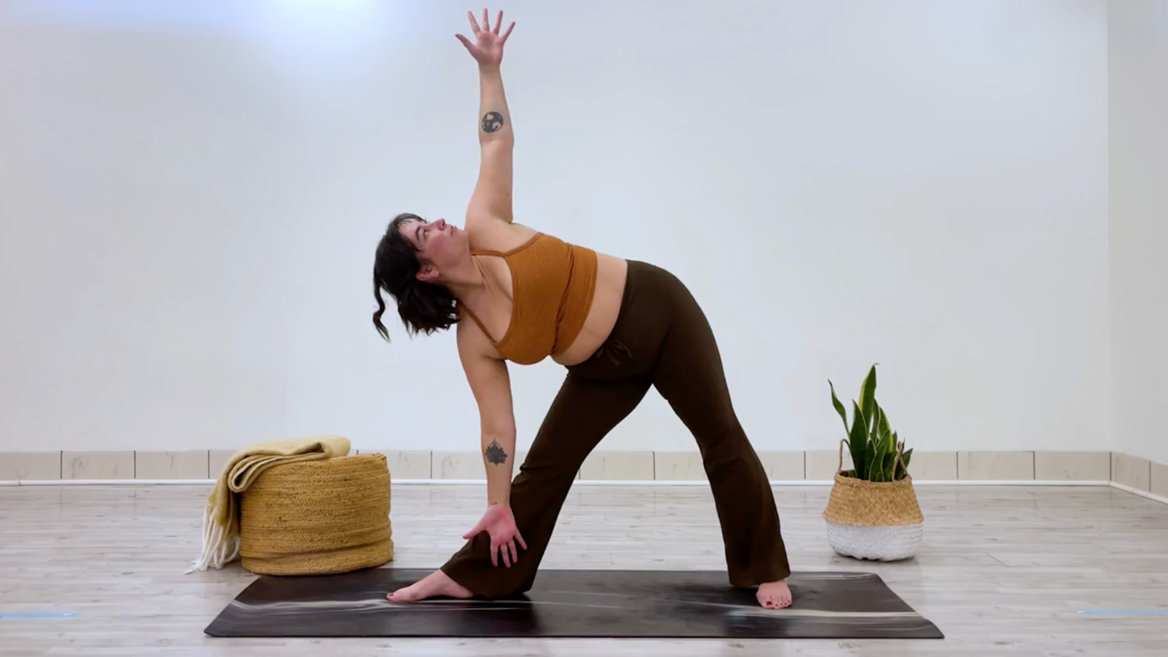 Teacher Taylor Lorenz in Triangle Pose