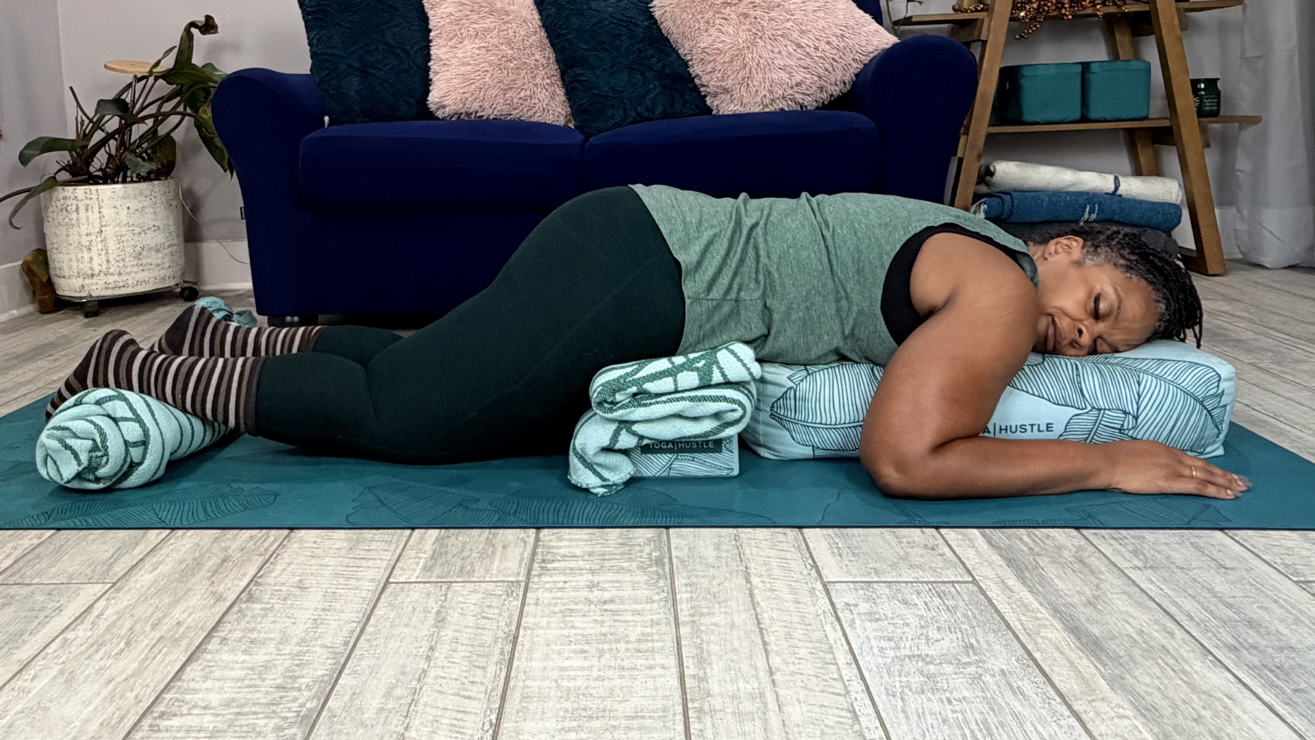 Woman lying on her belly in a version of Belly Savasana