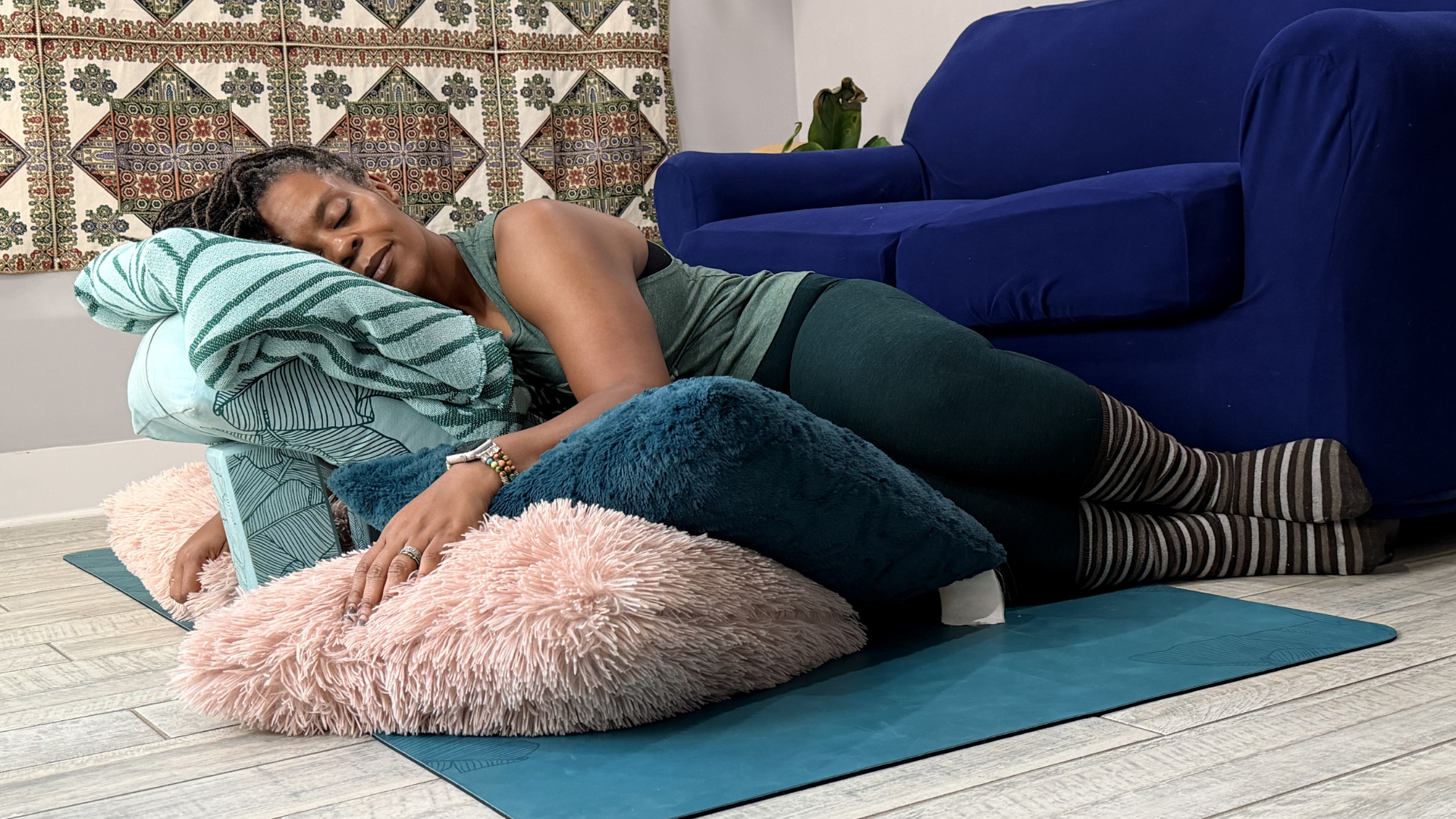 Woman resting on pillows and blankets