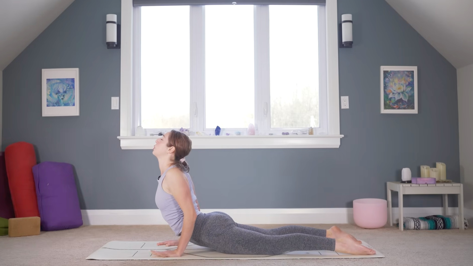 Woman lying on a yoga mat with her chest lifted