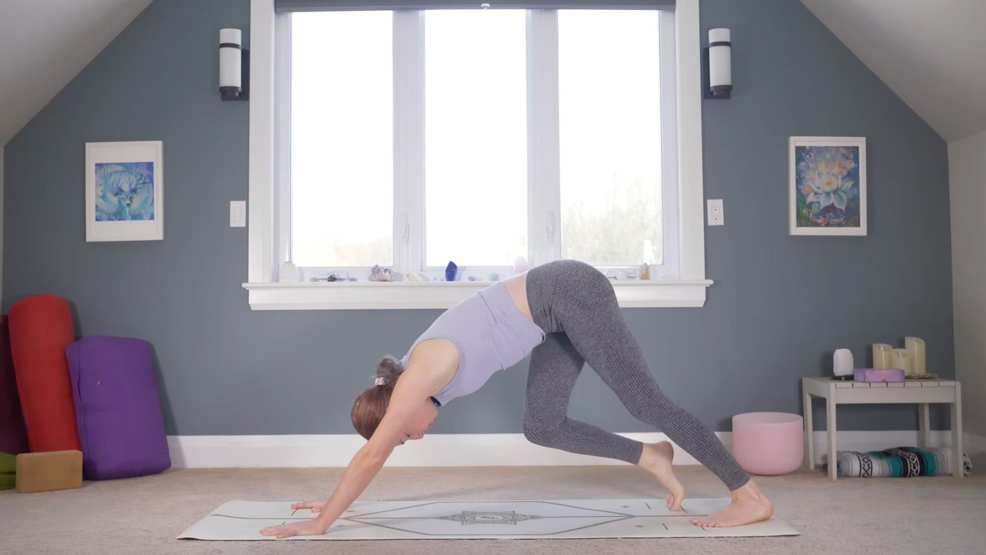 Woman in Downward-Facing Dog on a mat