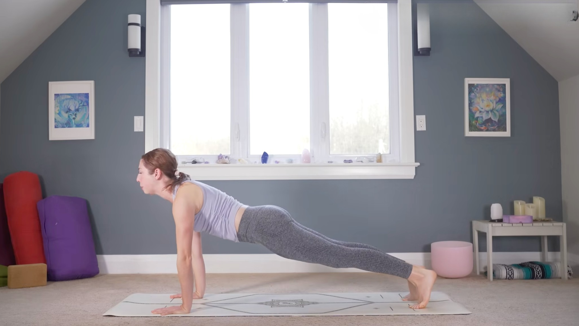 Woman in the top of a push-up or Plank Pose