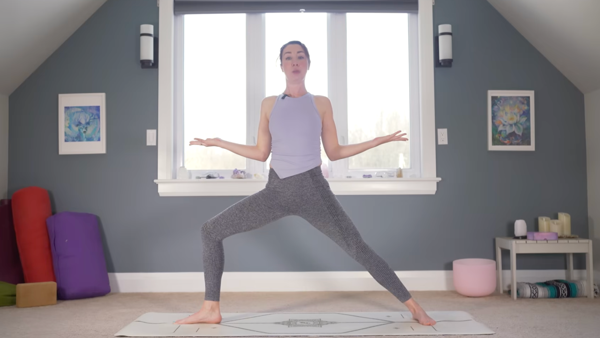 Woman in Warrior 2 Pose doing a shoulder stretch