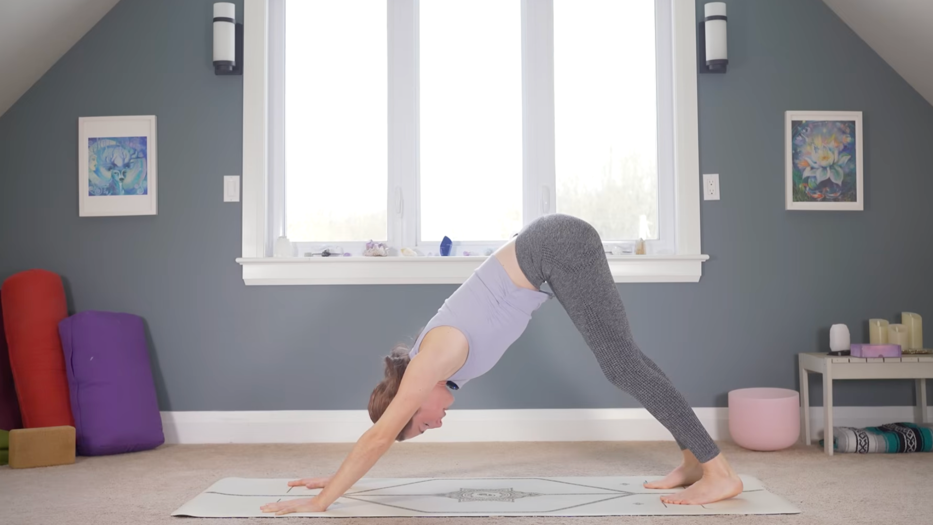 Woman on a mat in Downward-Facing Dog