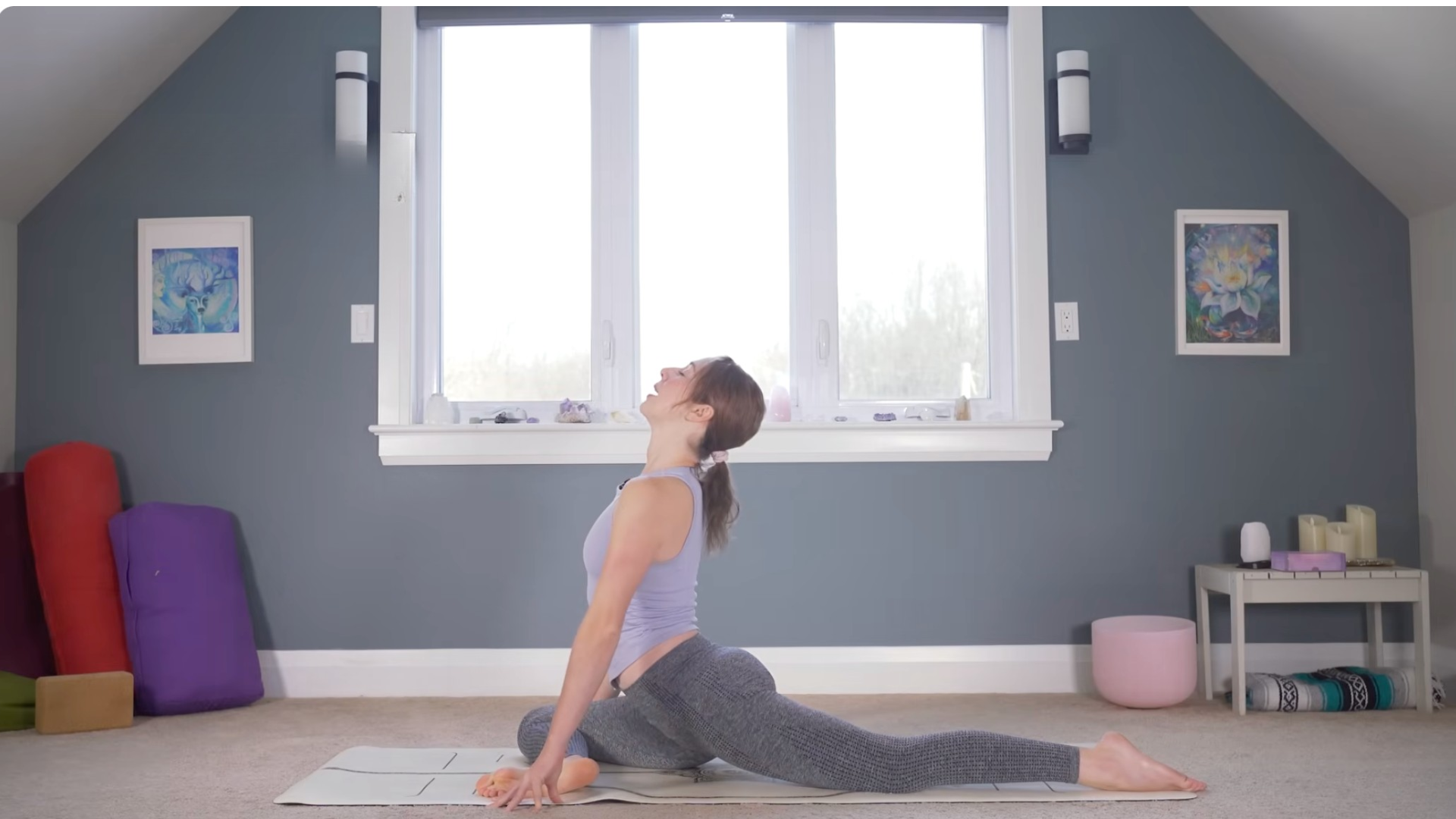 Woman in Pigeon Pose with a slight backbend