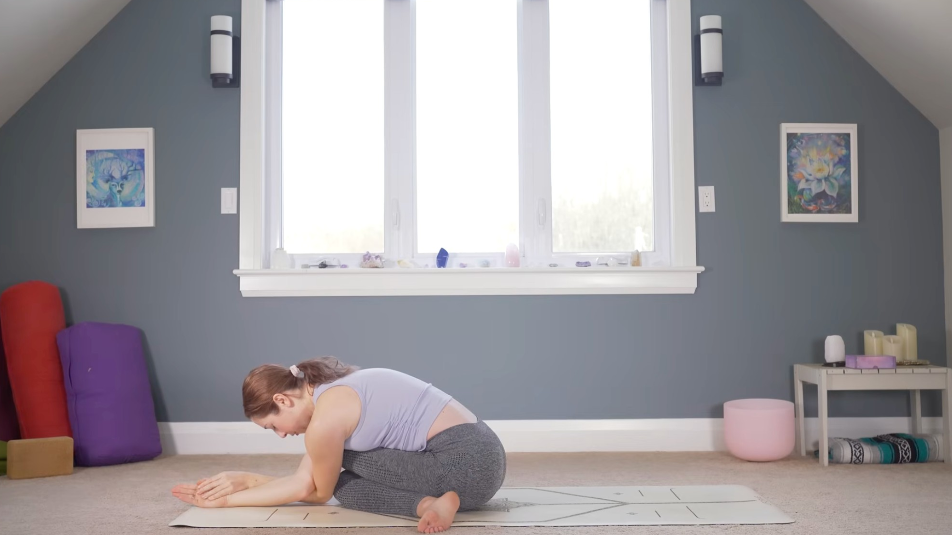 Woman leaning forward in Cow-Face Pose