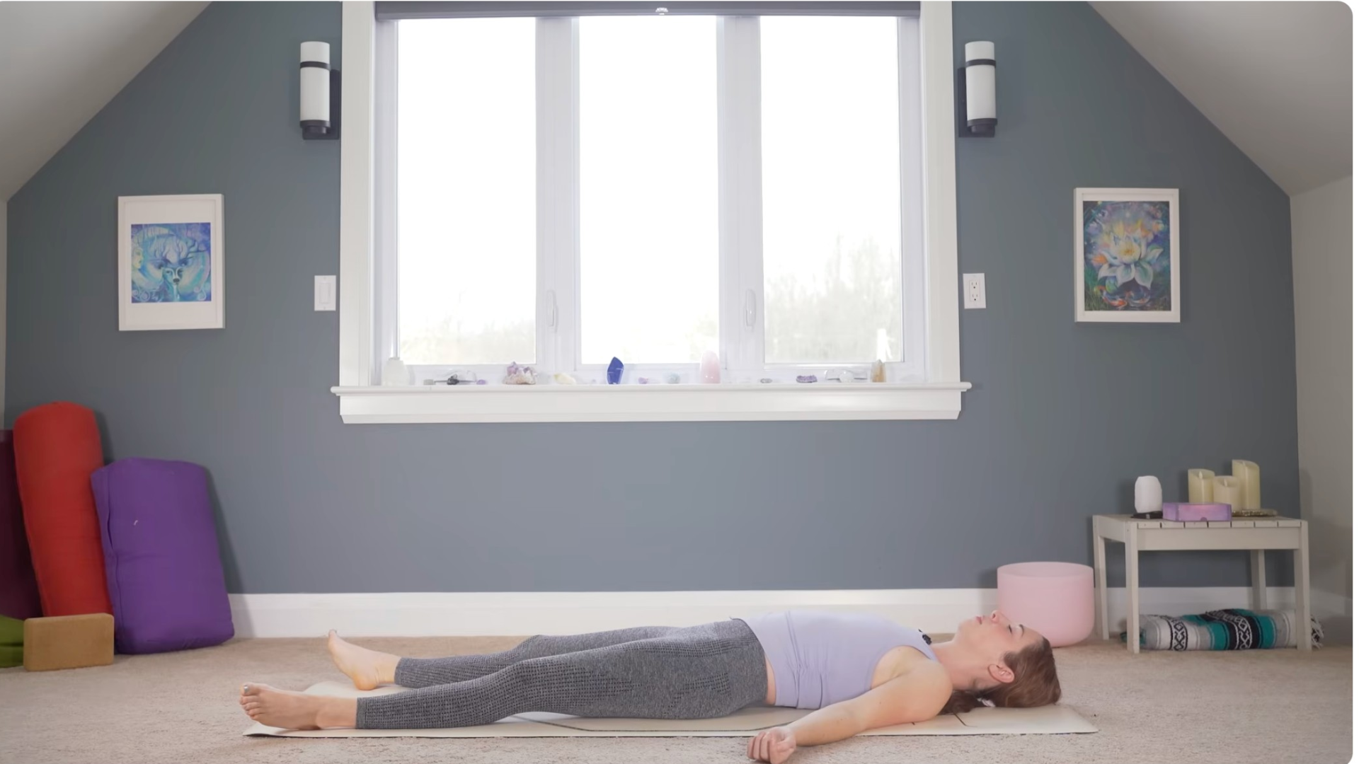 Woman lying on her back in Savasana during a slow yoga for flexibility class