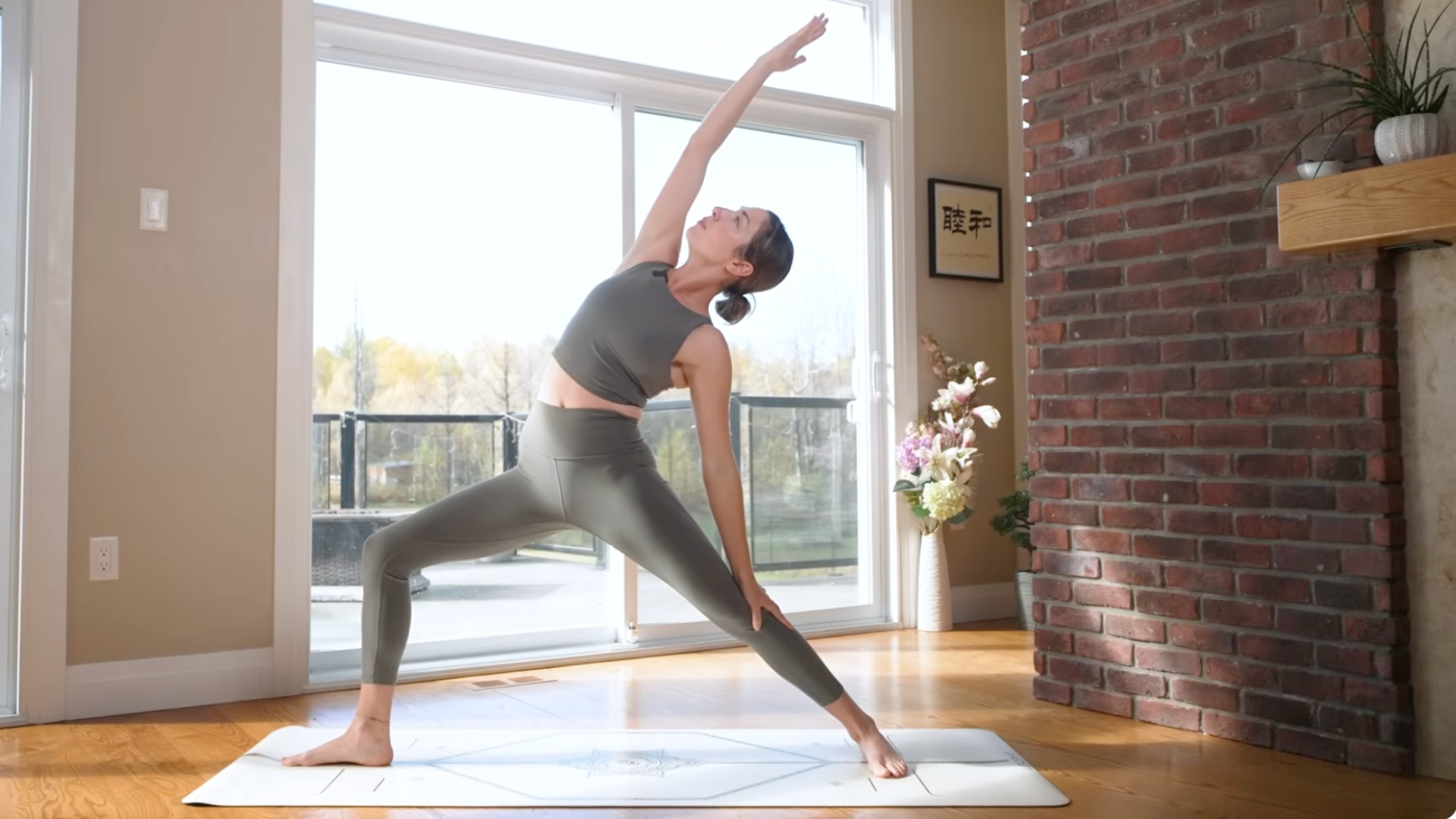 Woman in a Reverse Warrior Pose while standing on a mat