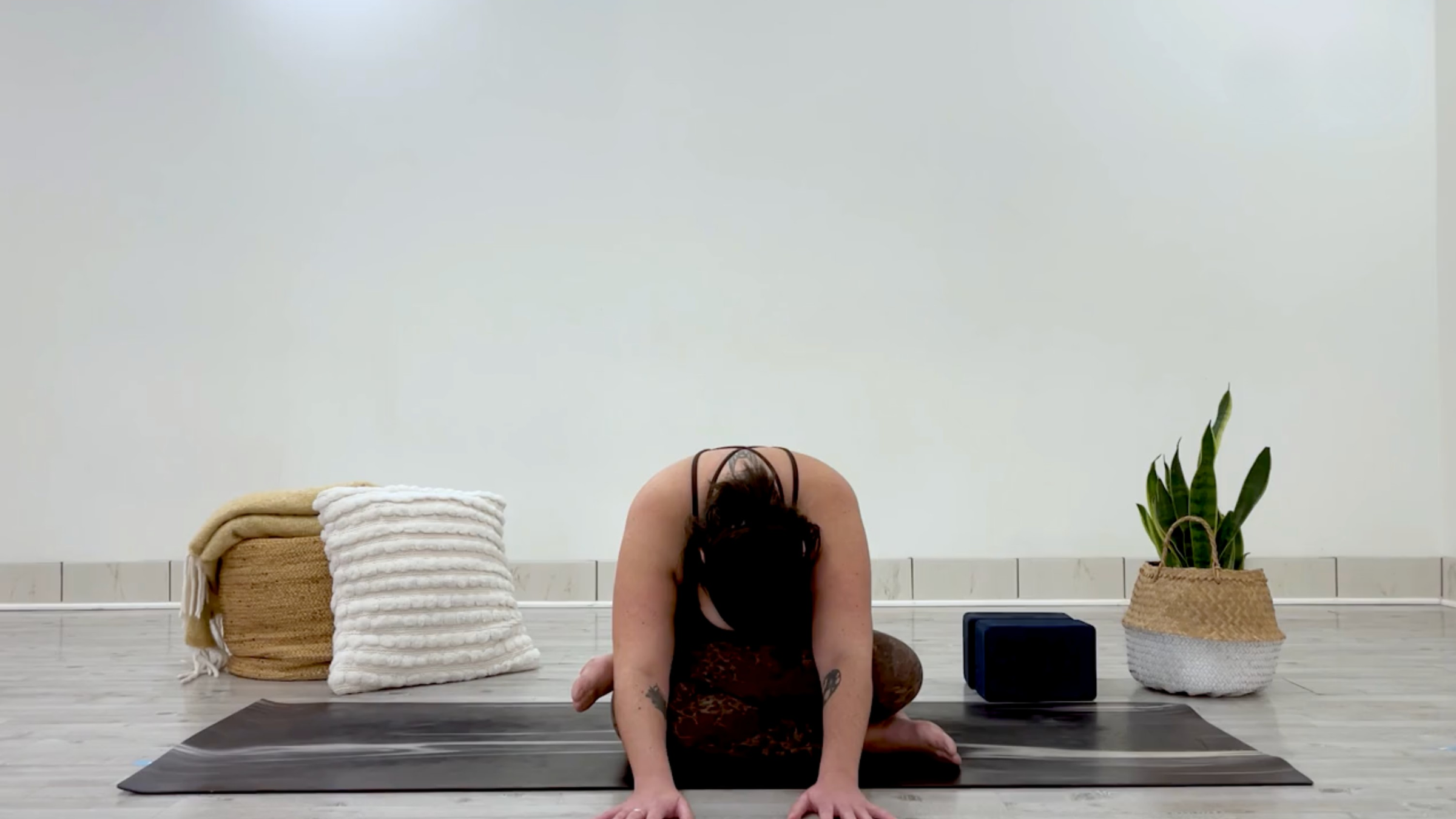 Teacher Taylor Lorenz in Firelog Forward Bend