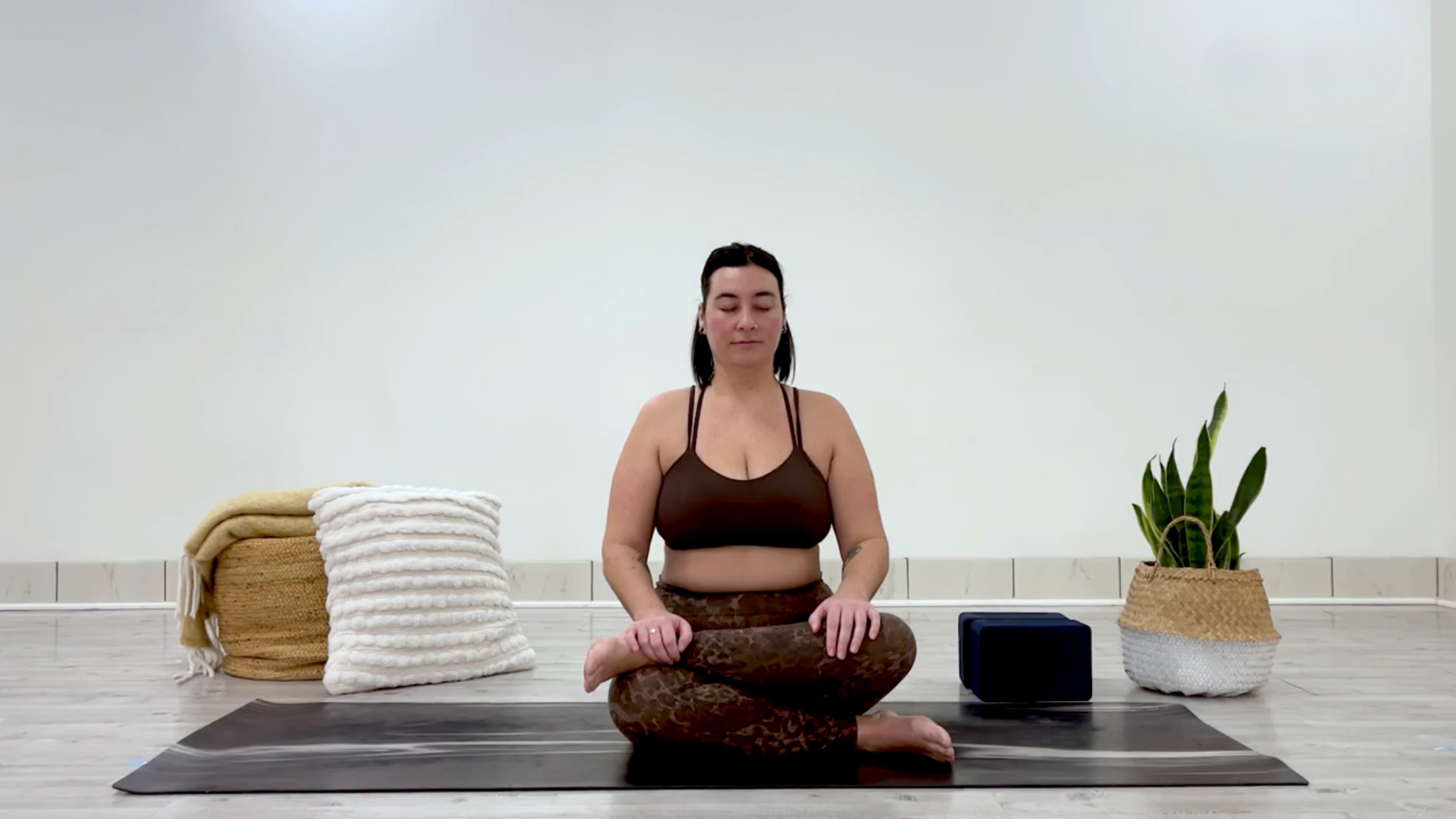 Yoga teacher Taylor Lorenz in Firelog Pose, part of her yin yoga for hips and hamstrings practice