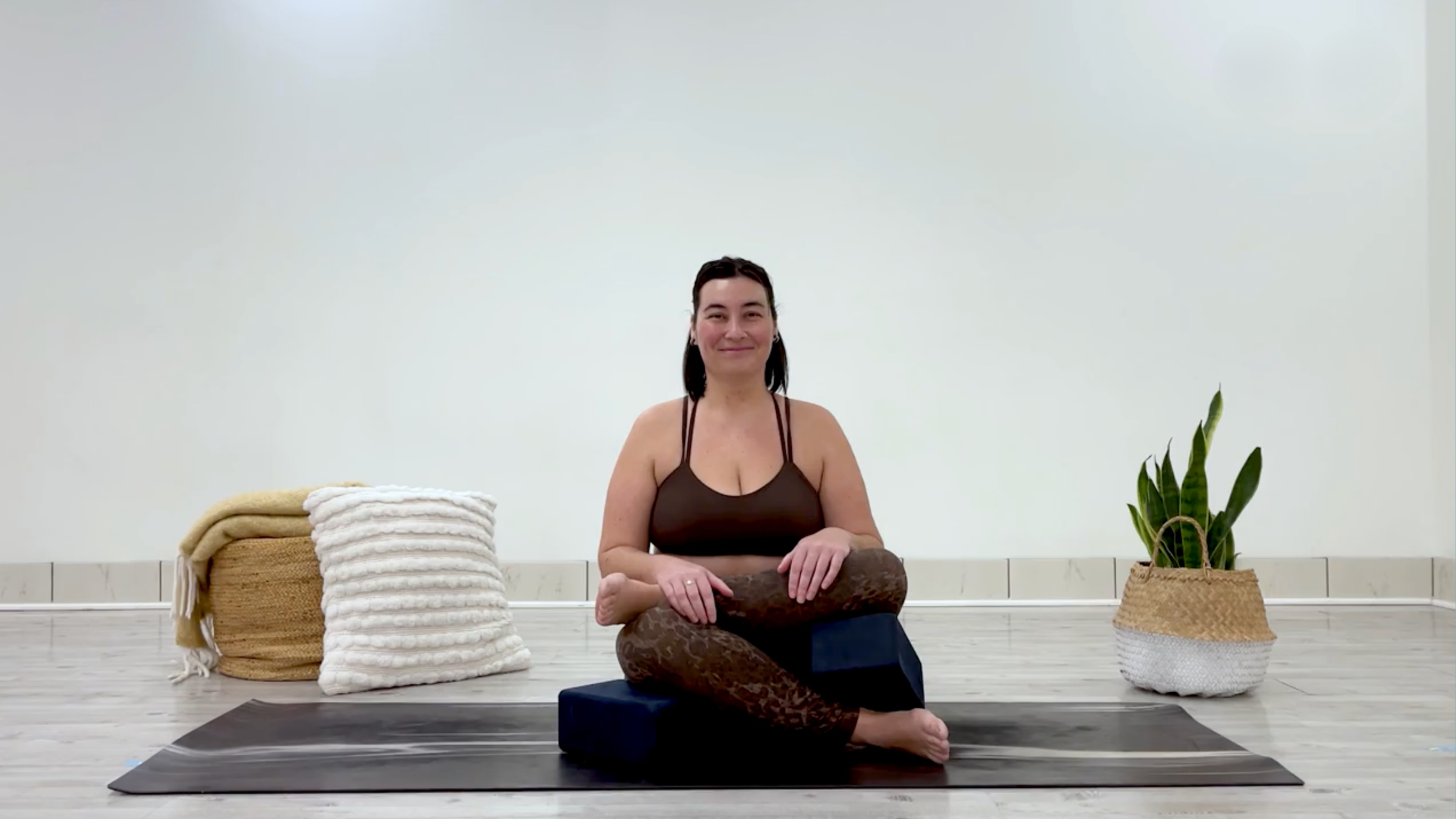 Teacher Taylor Lorenz in supported Firelog Pose