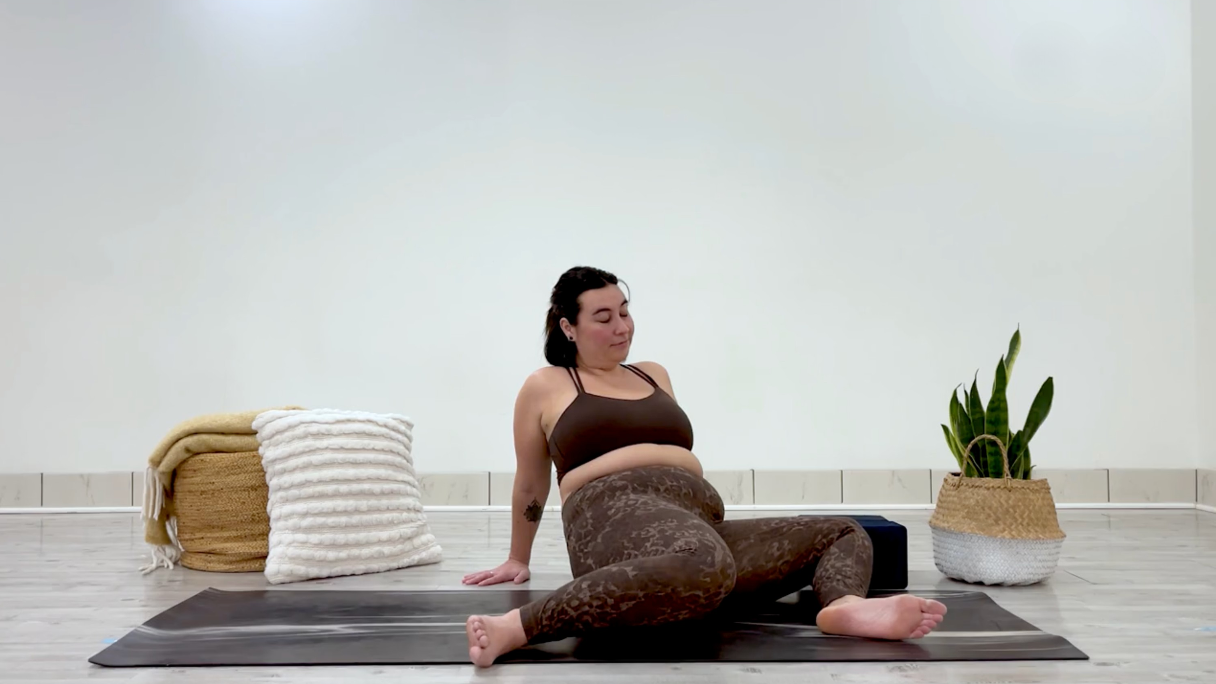 Yoga teacher Taylor Lorenz in Windshield Wipers, part of her yin yoga for hips and hamstrings practice