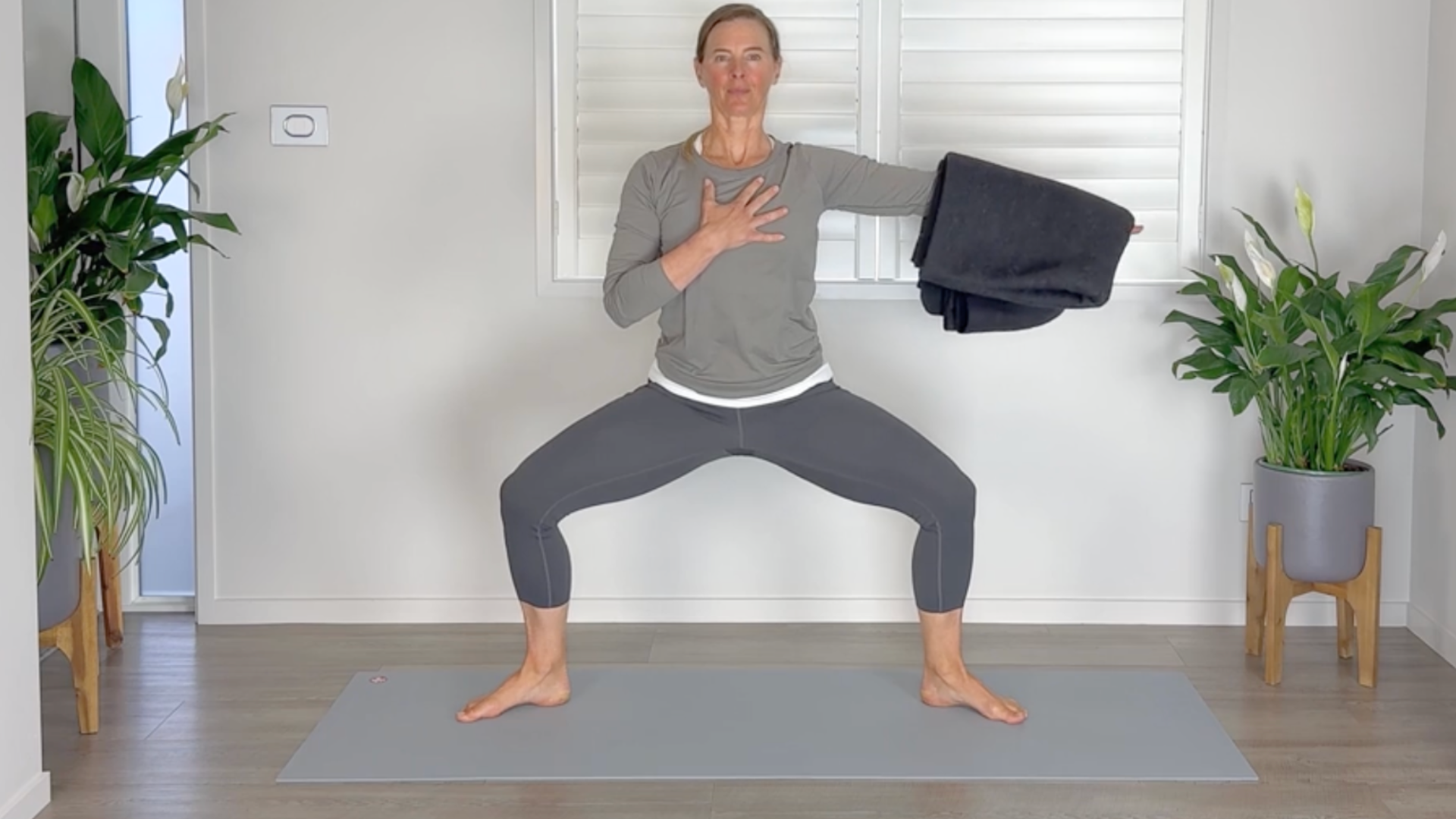 Woman in goddess pose with arms outstretched