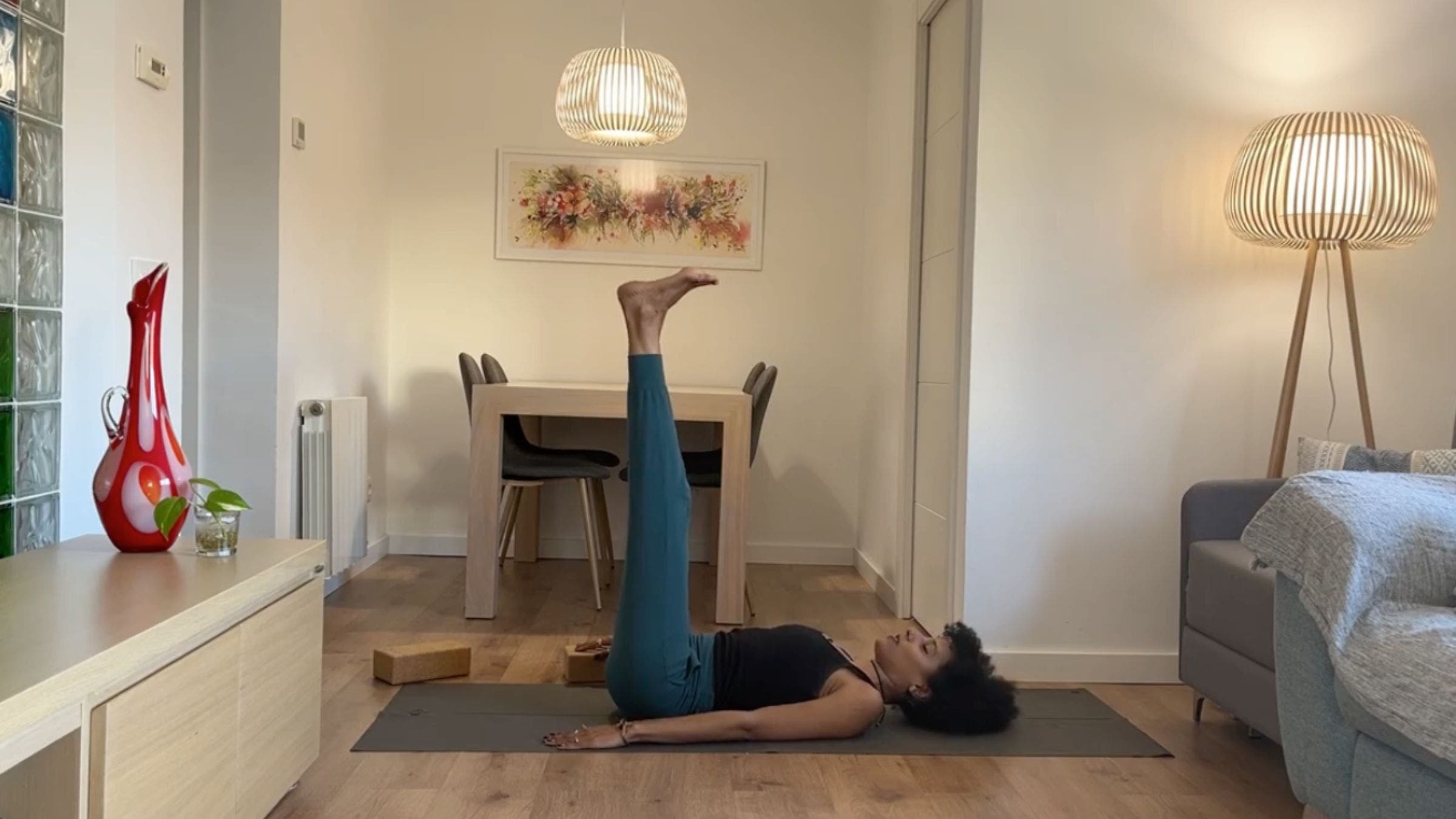 Yoga instructor practicing Waterfall Pose.
