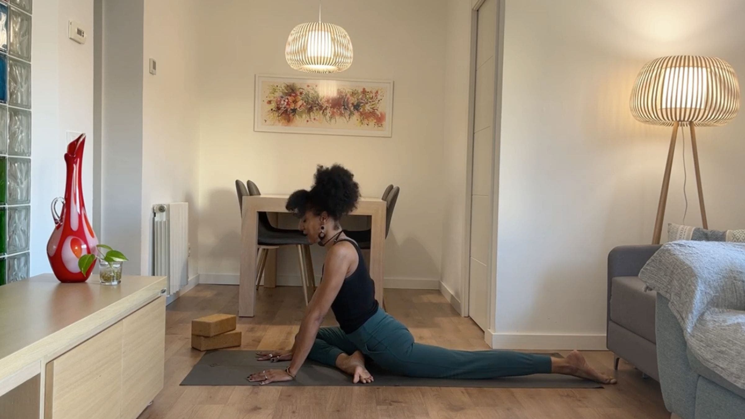 Yoga instructor practicing Pigeon Pose.