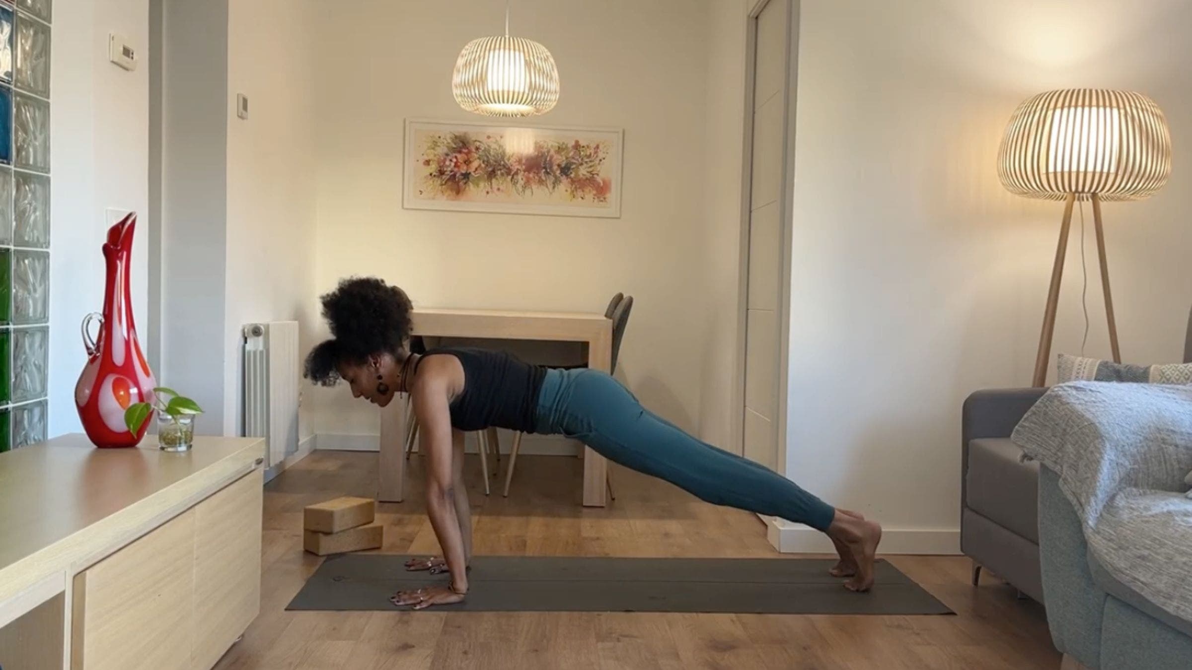 Yoga instructor practicing Plank Pose.